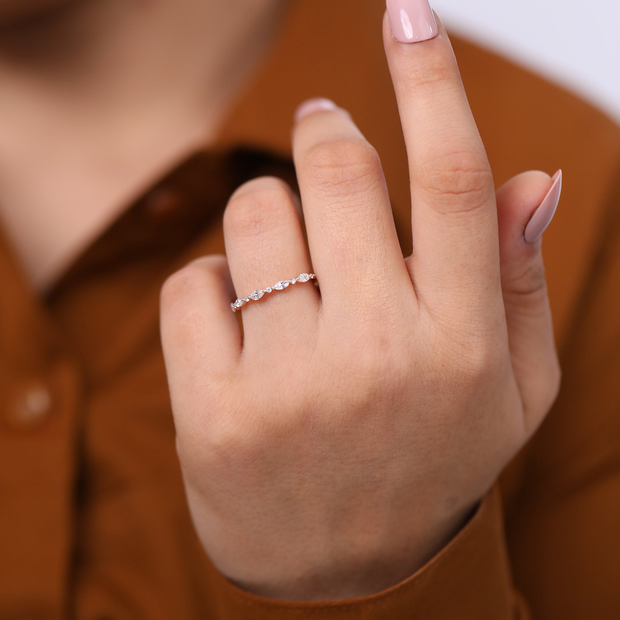 Minimalist rose gold band featuring marquise and round lab grown diamond accents