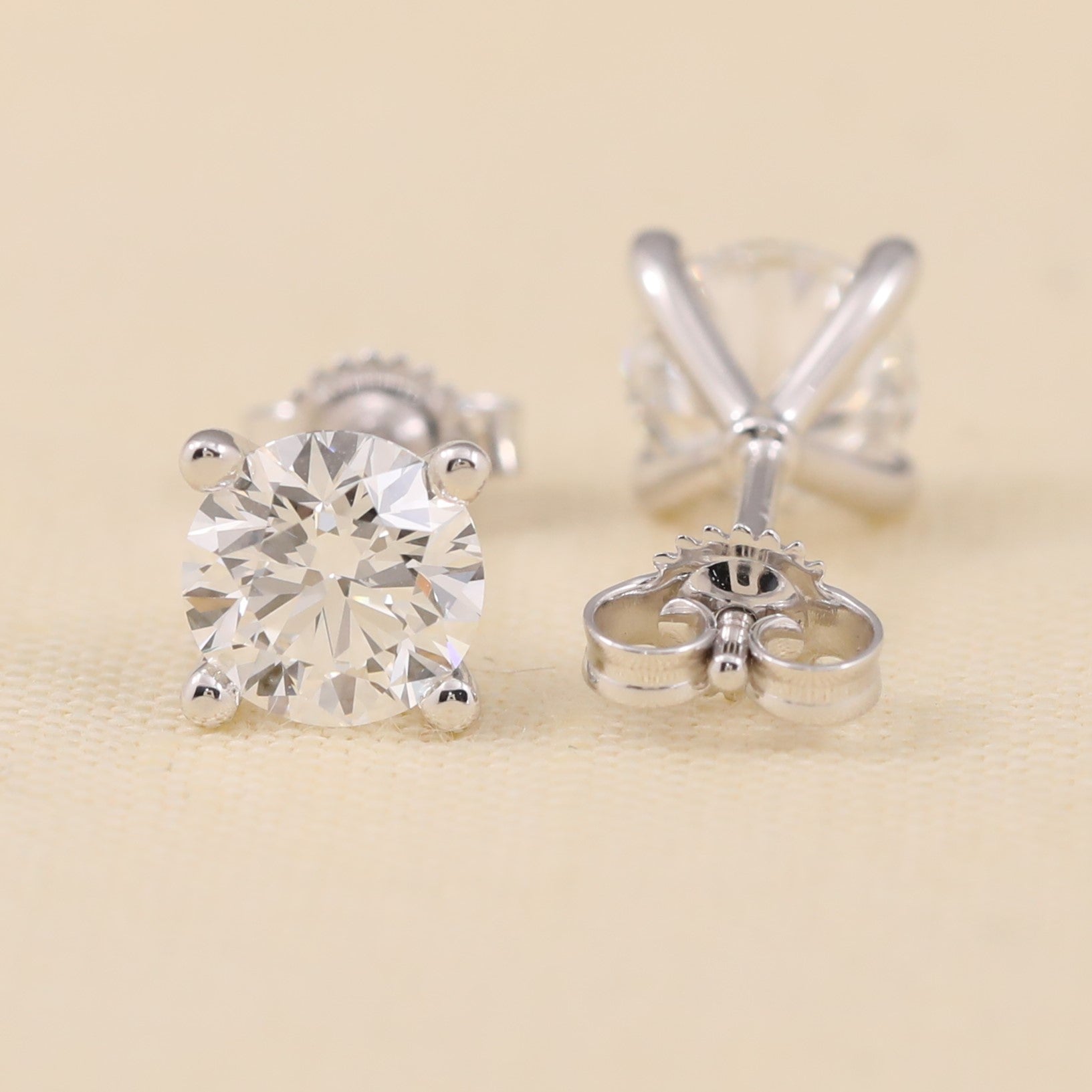 Minimalist lab-grown diamond earrings featuring a clean four-prong mount