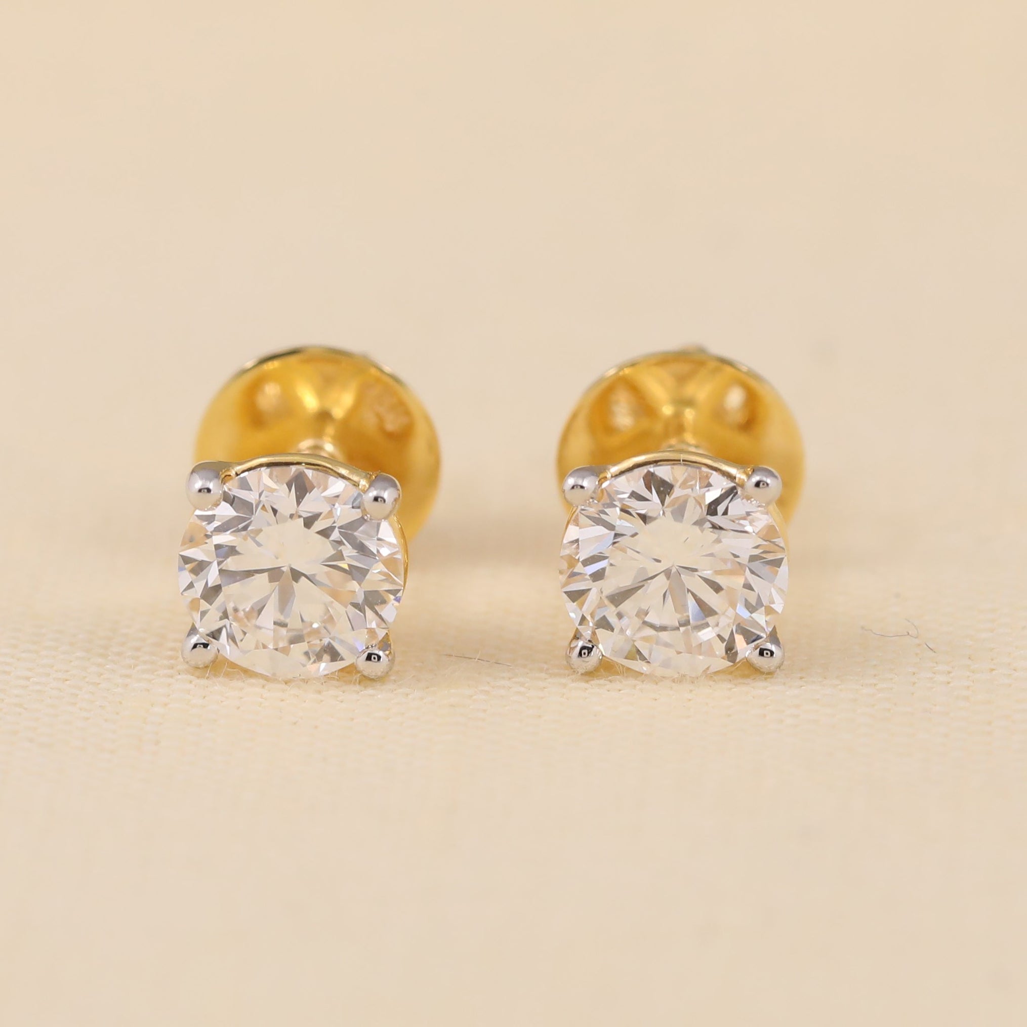 Round cut diamond stud earrings perfect for gifting or anniversary celebrations.