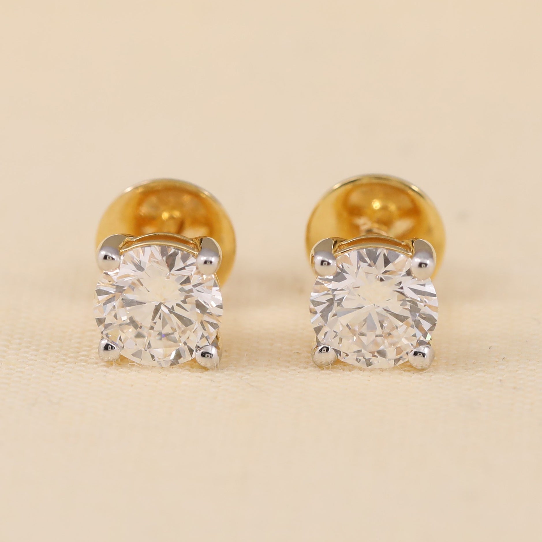 Round cut diamond stud earrings perfect for gifting or anniversary celebrations.