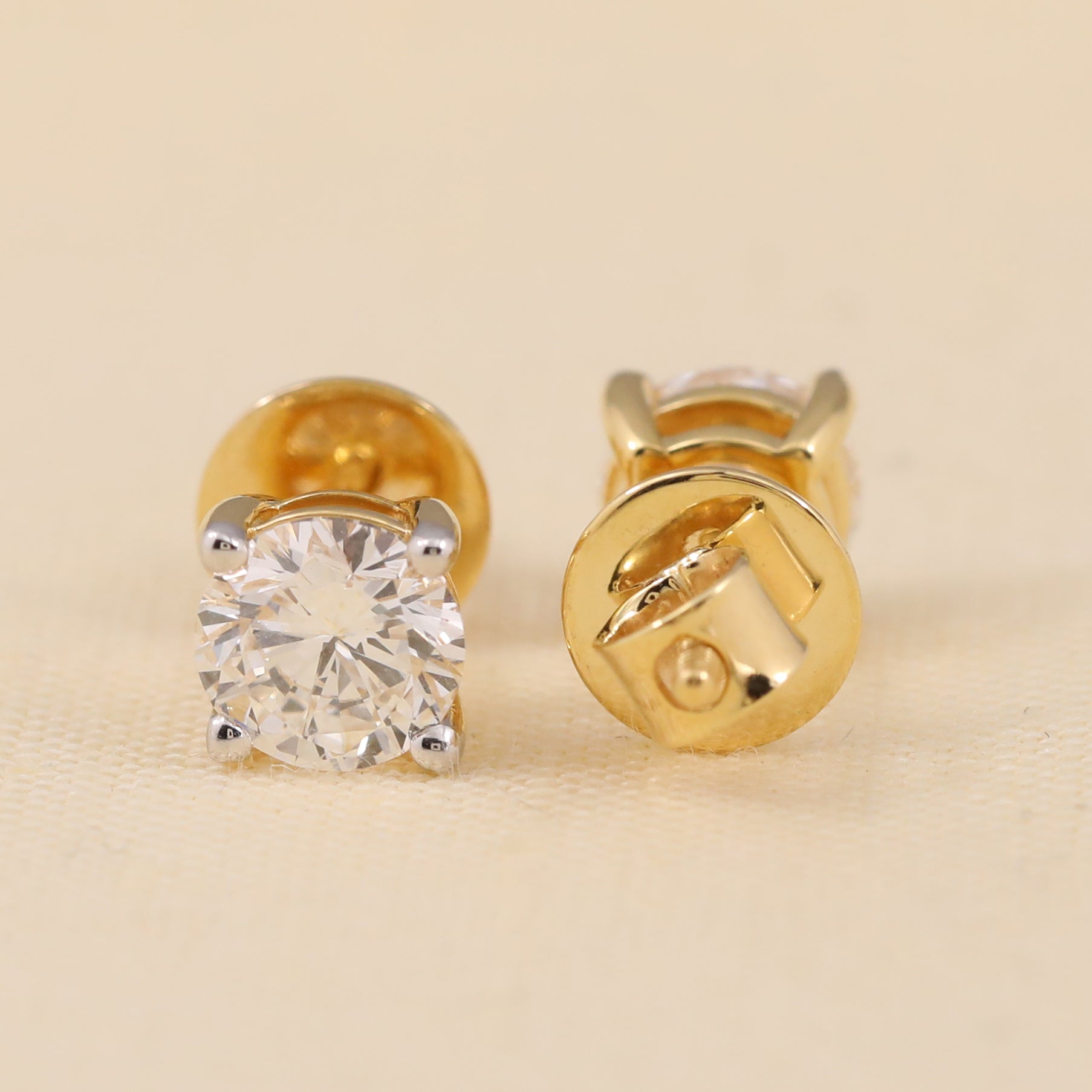 Elegant round diamond studs ideal for weddings or festive occasions.