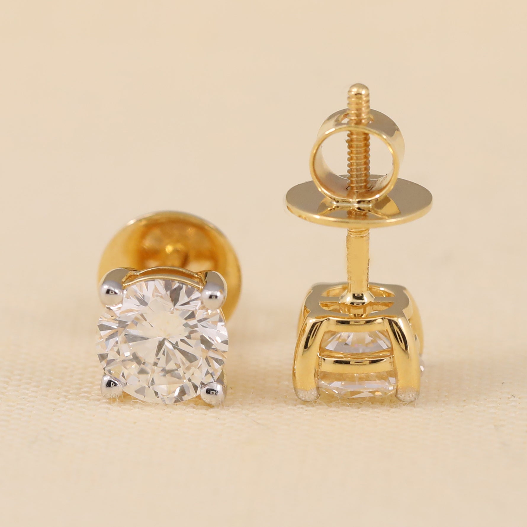 Classic round cut diamond earrings suited for daily wear and gifting.