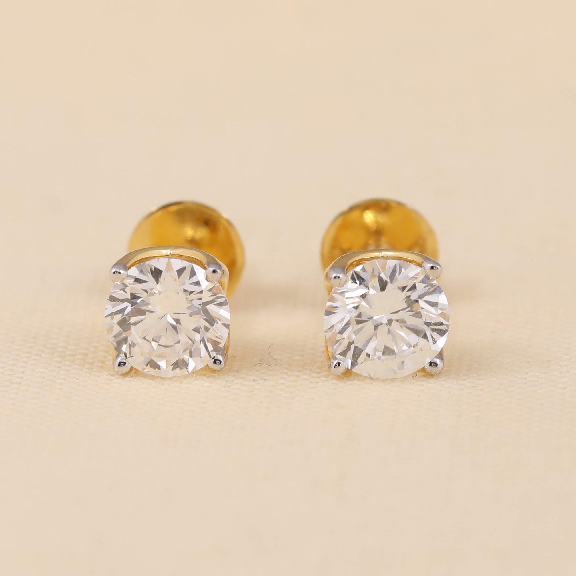 Round cut diamond stud earrings perfect for gifting or anniversary celebrations.