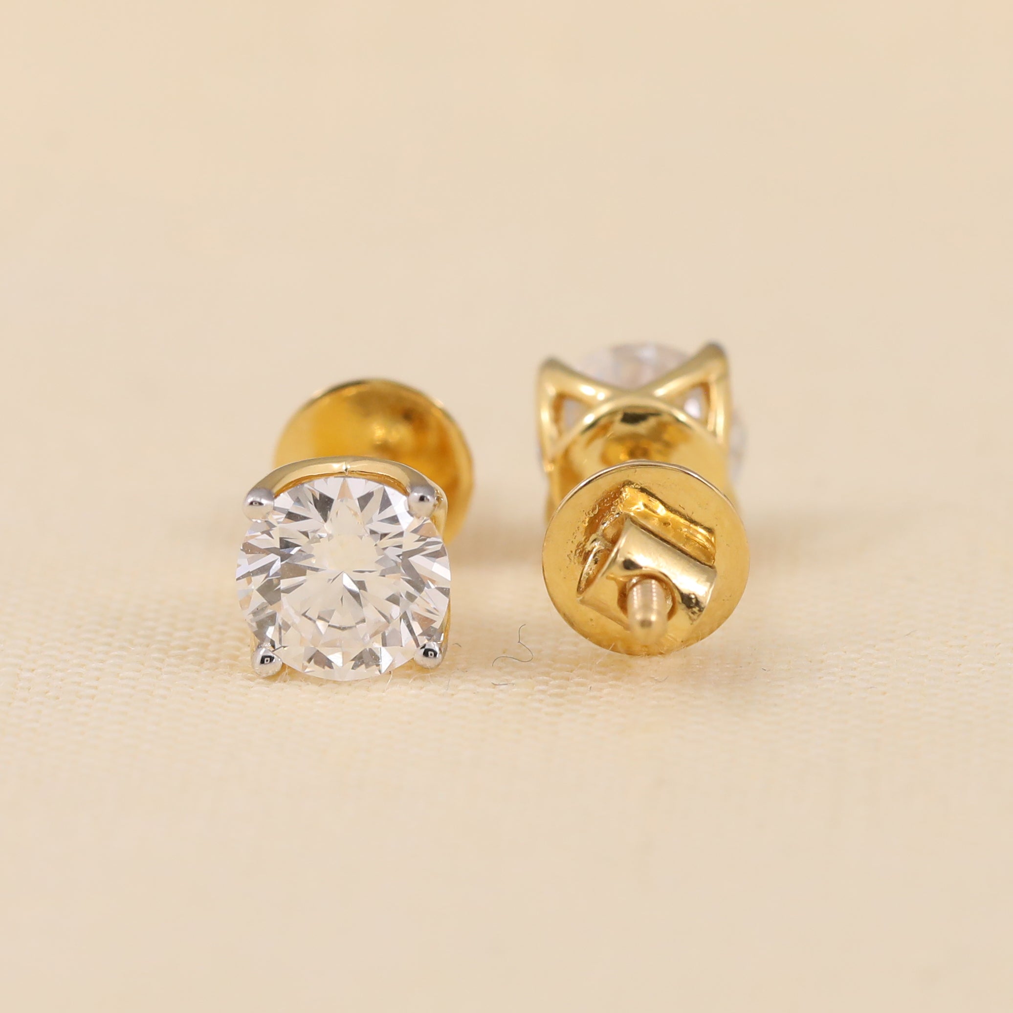 Elegant round diamond studs ideal for weddings and festive occasions.