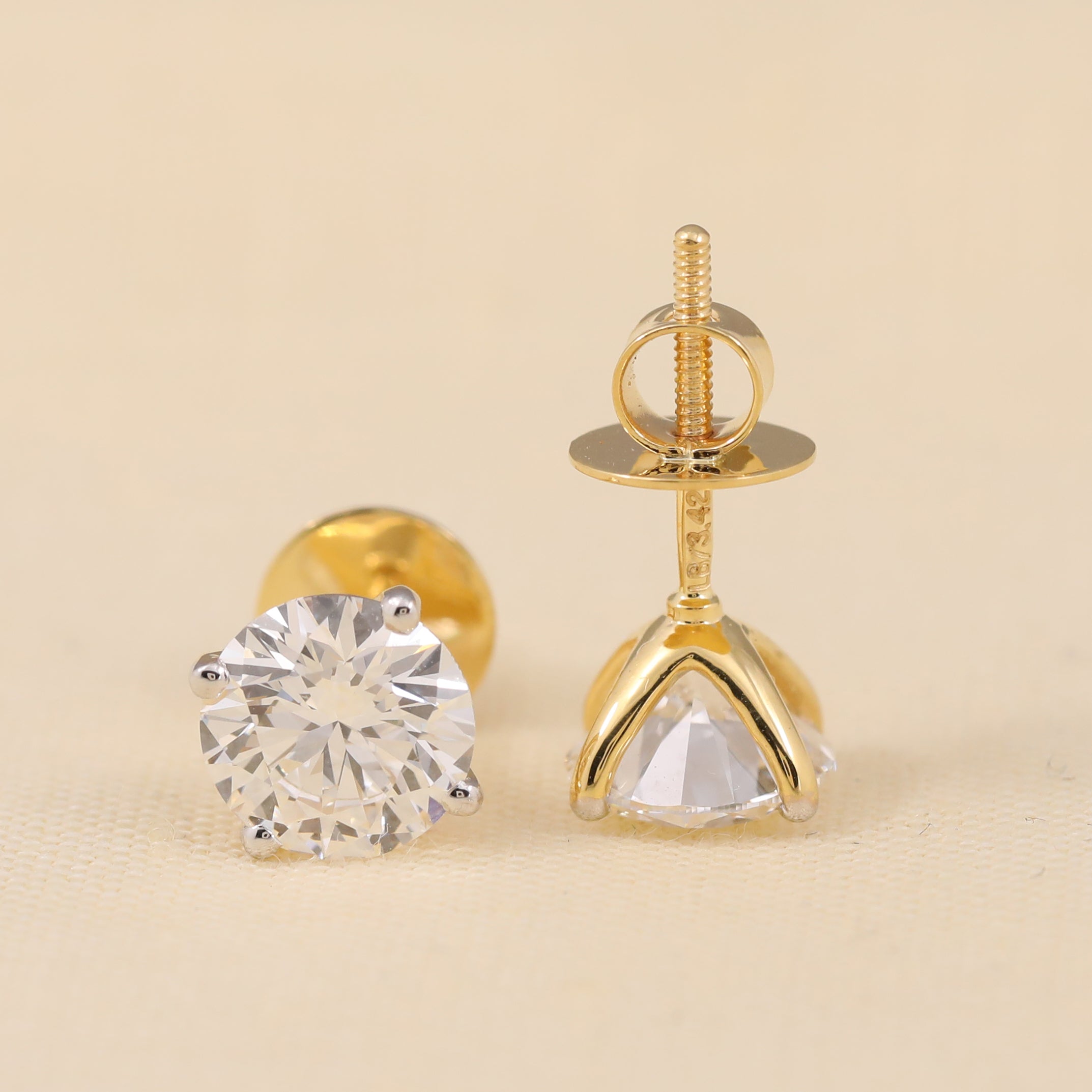 Brilliant round cut diamond stud earrings, perfect bridal and party jewelry.