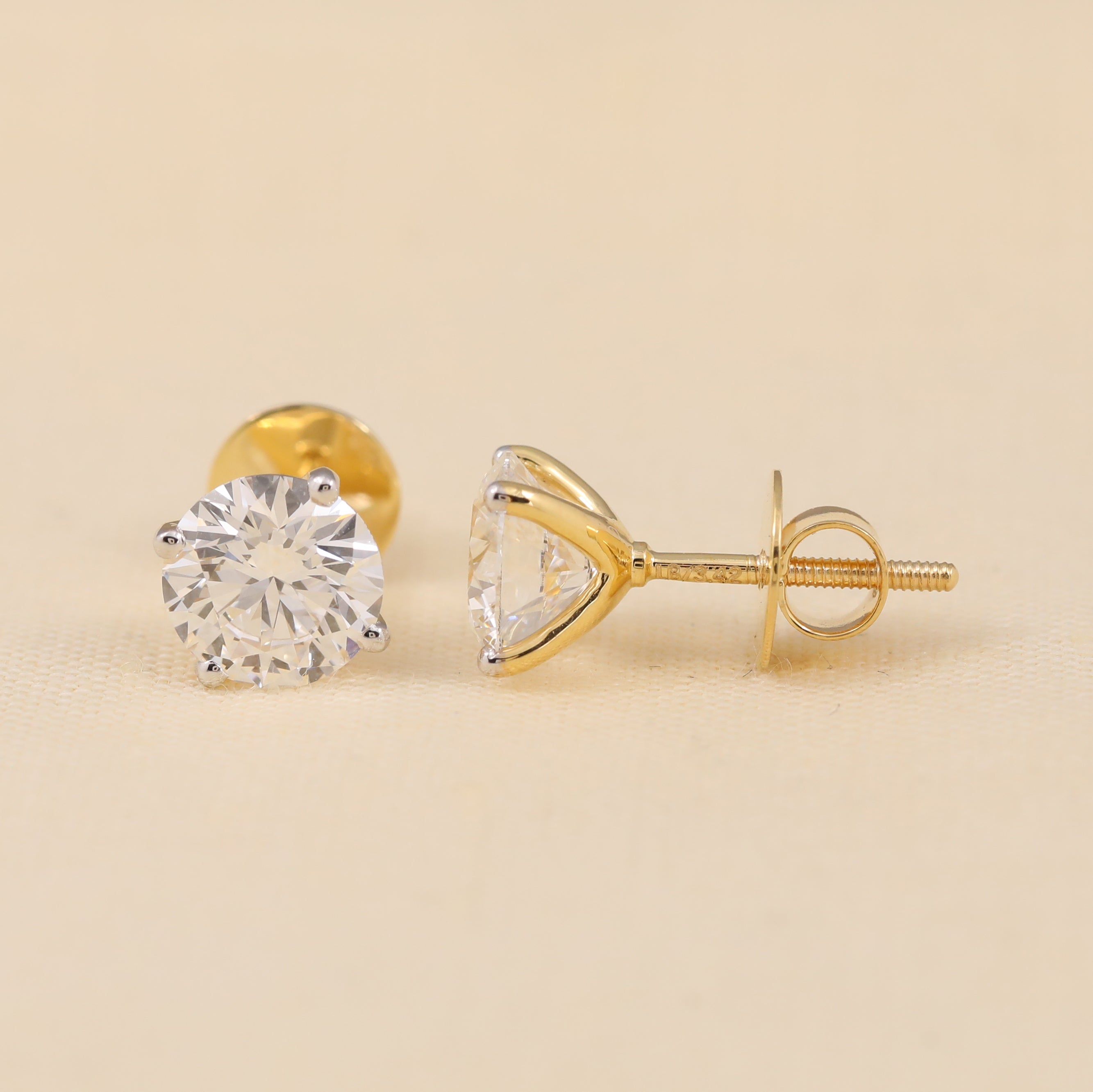 Women’s round diamond stud earrings, top trending wedding gift jewelry.
