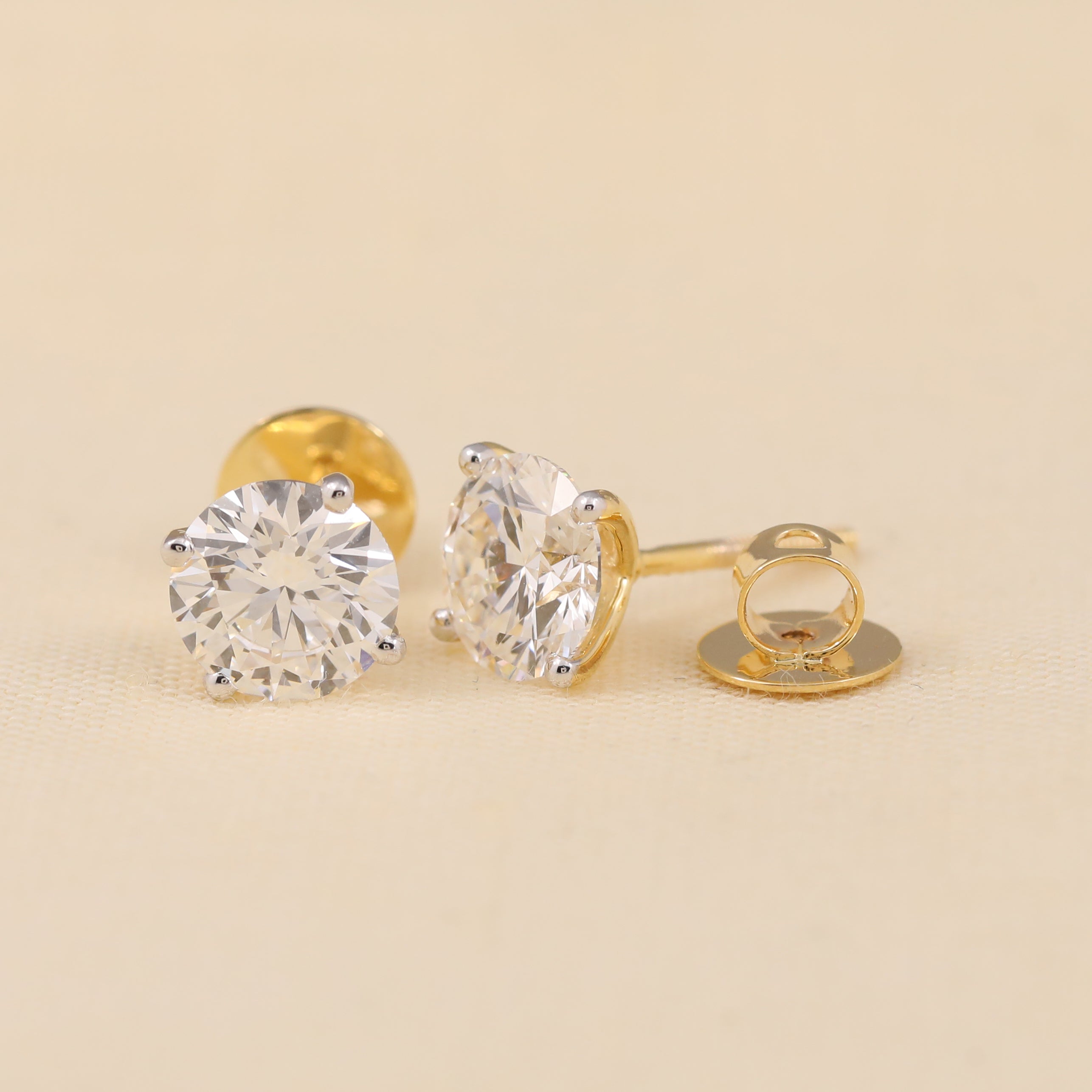 Sparkling round diamond earrings for women, perfect for festival gifting.