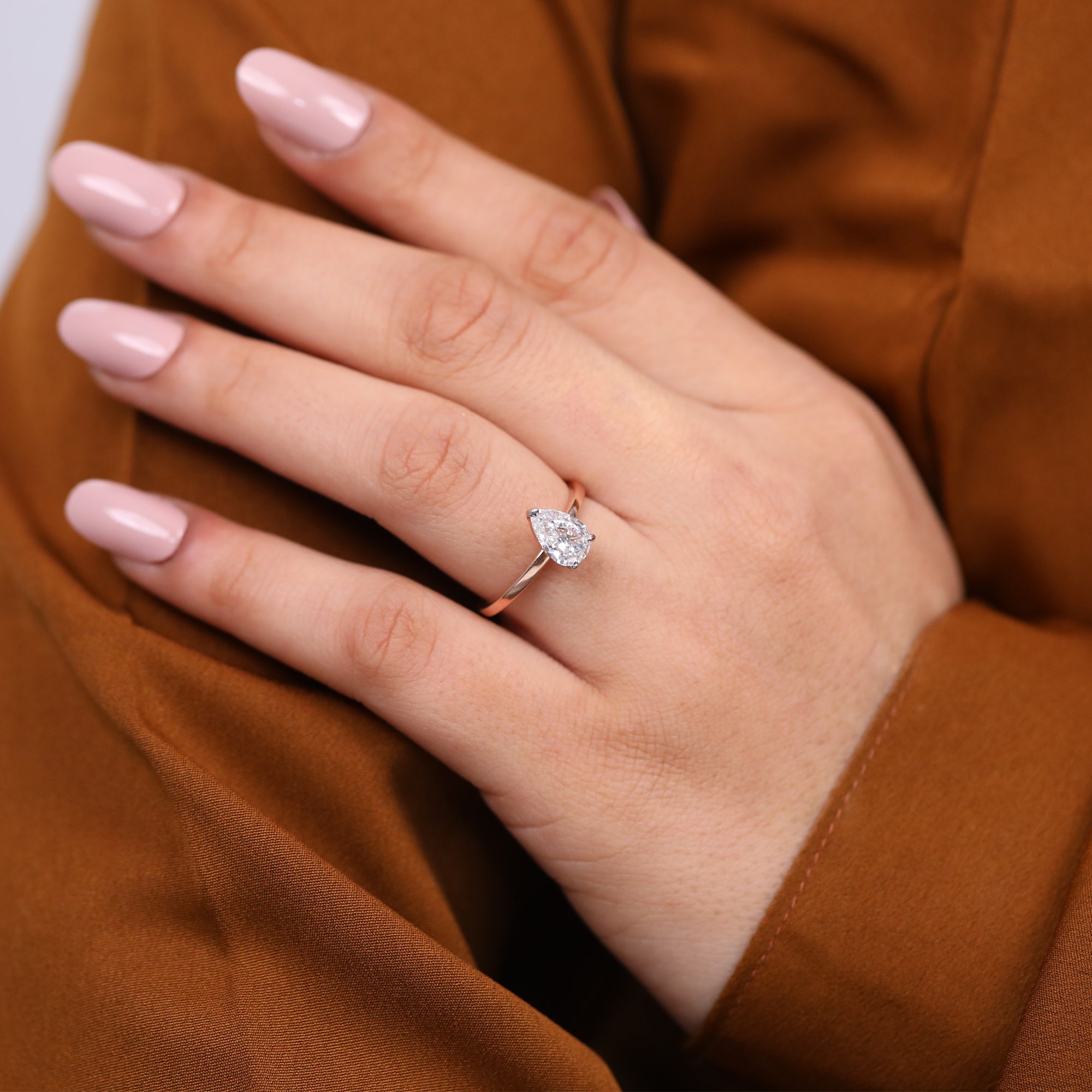Fine jewelry solitaire ring showcasing a pear cut lab grown diamond