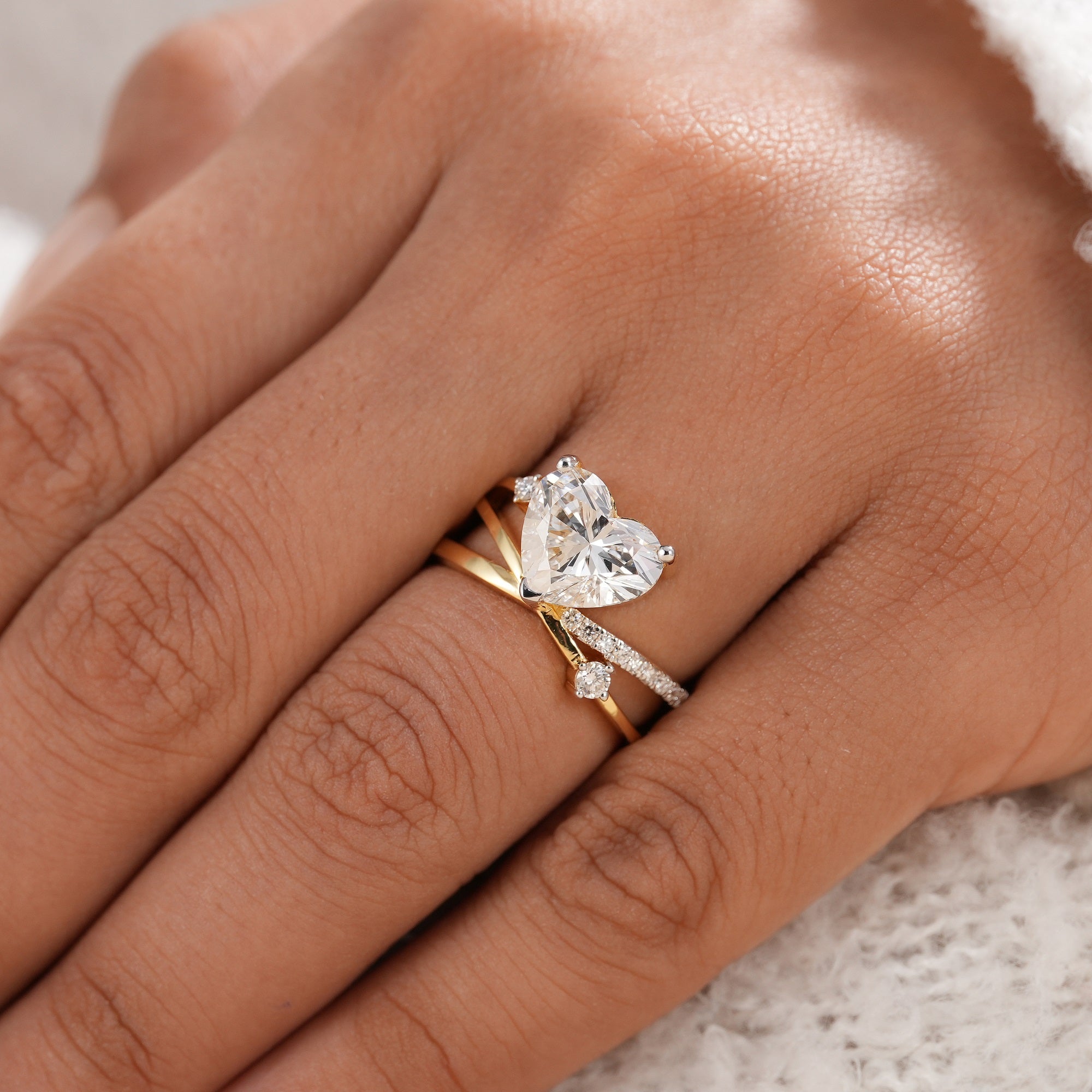 Heart shaped lab diamond ring with pavé diamond bypass shank