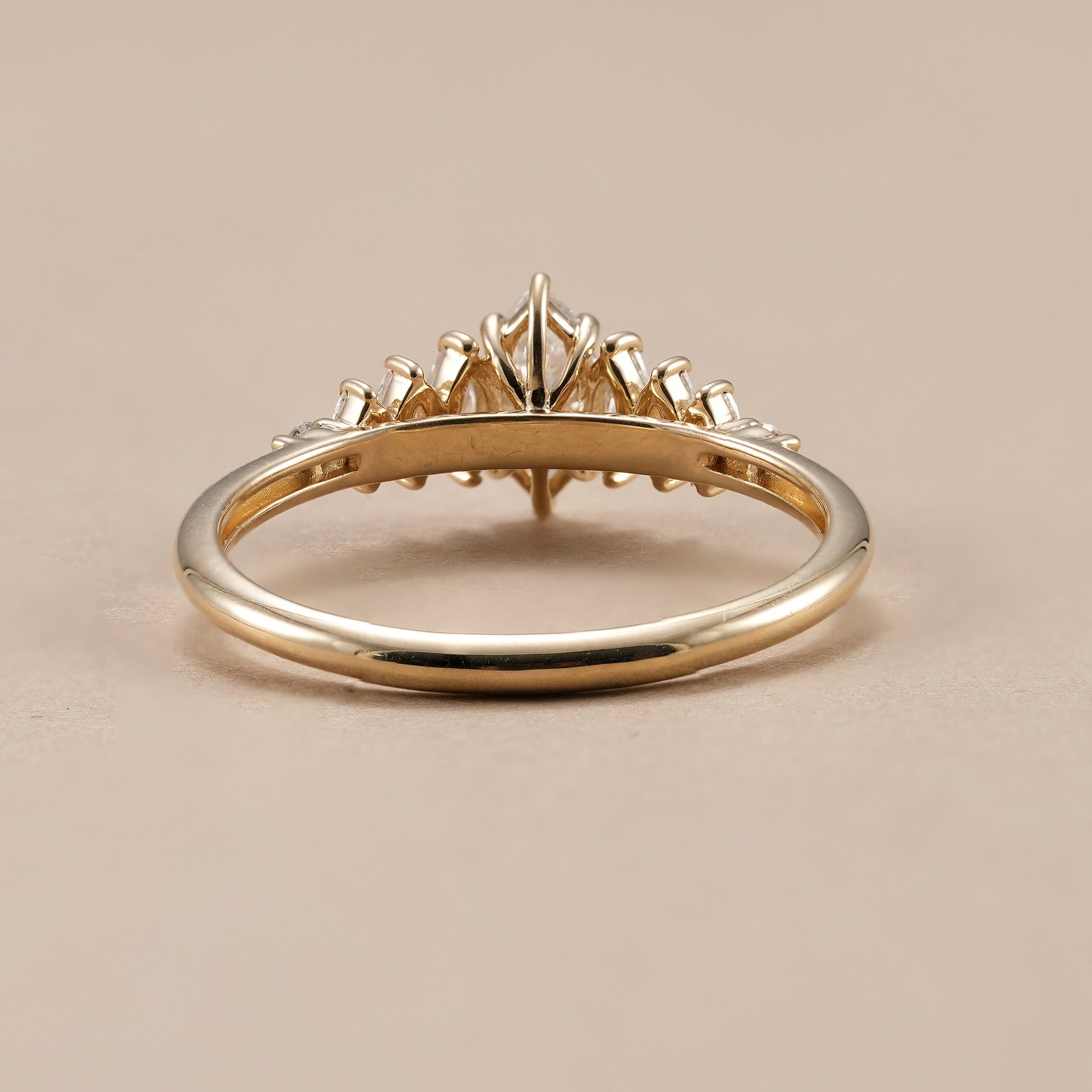 Marquise cut engagement ring with marquise and round side diamonds.