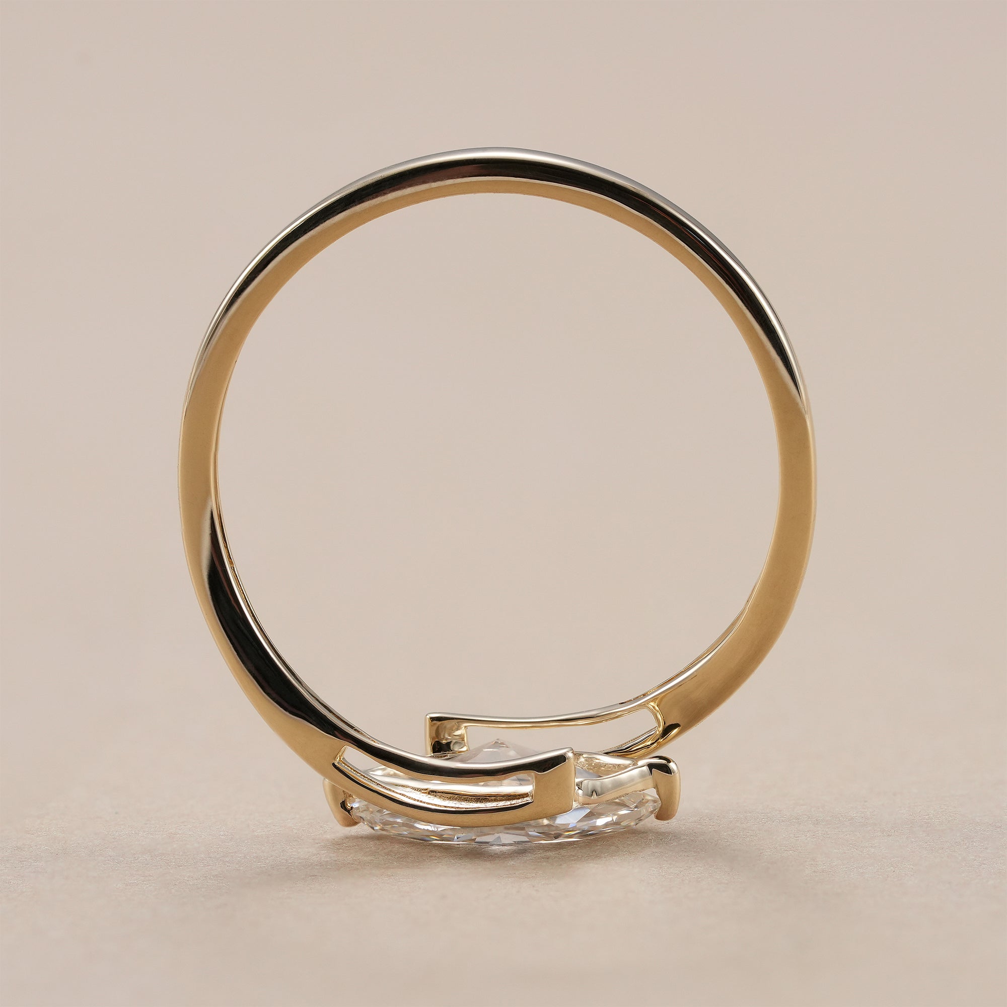 Modern marquise diamond engagement ring in solid gold.