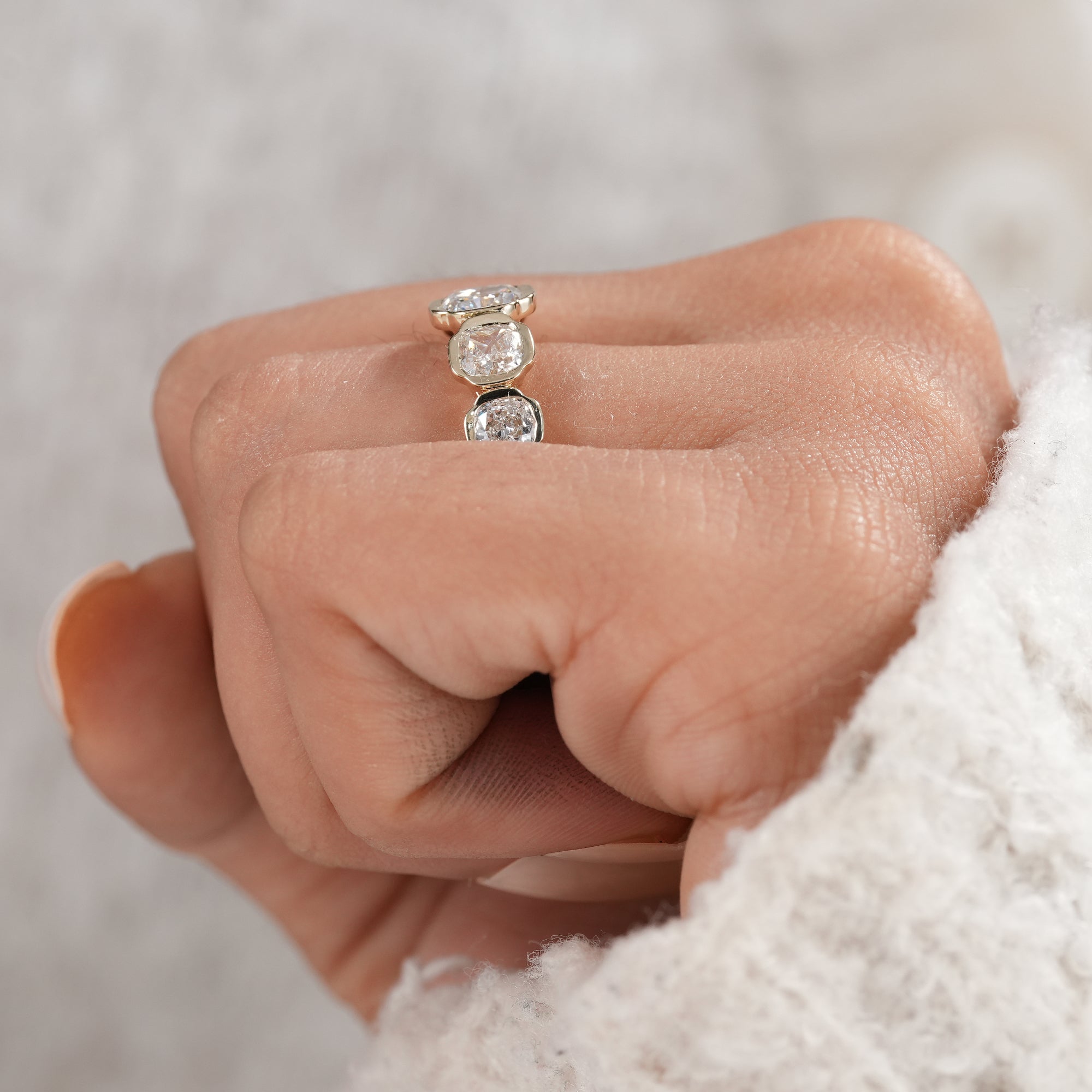 Cushion diamond wedding jewelry with five lab grown diamonds.