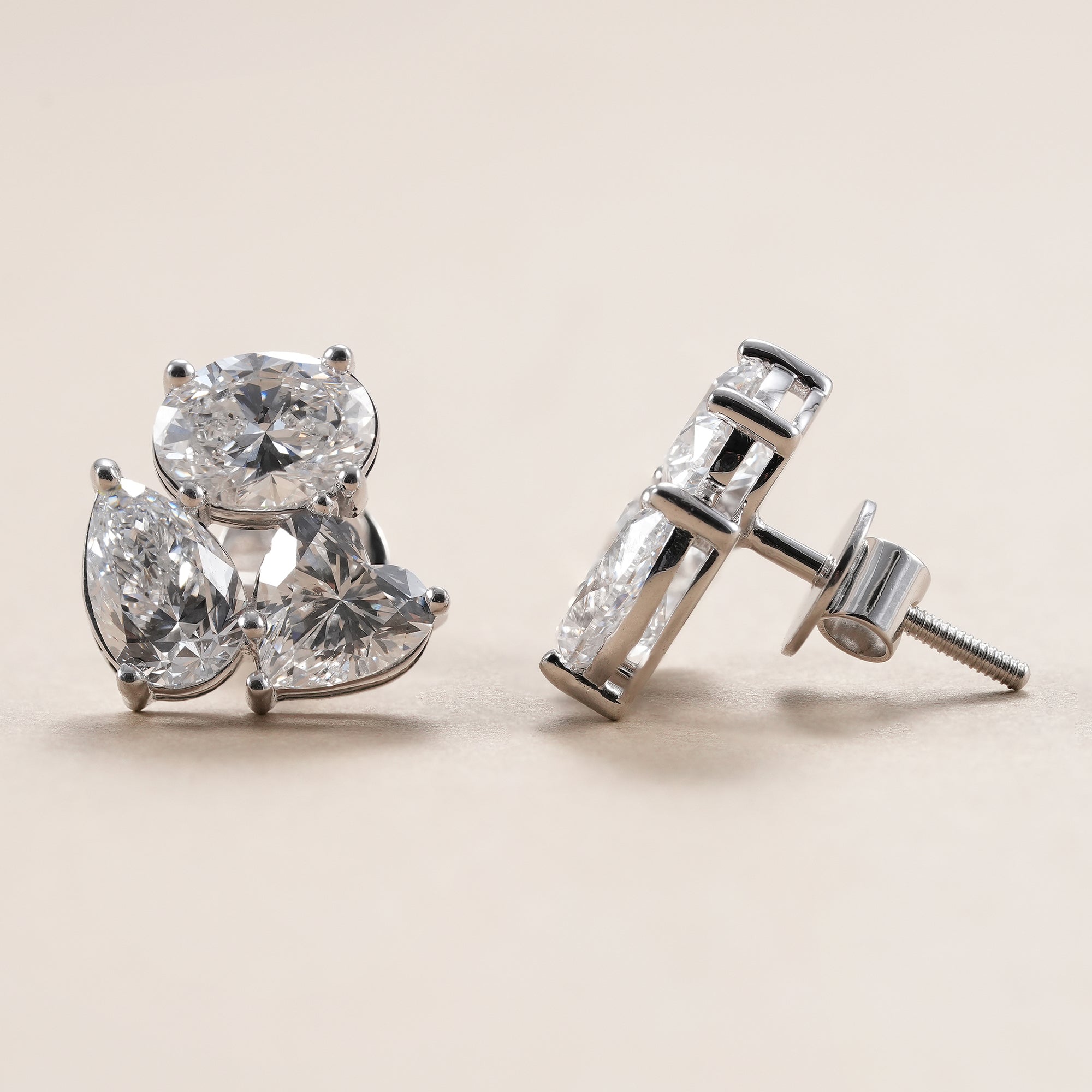 Oval pear heart diamond stud earrings with brilliant sparkle.