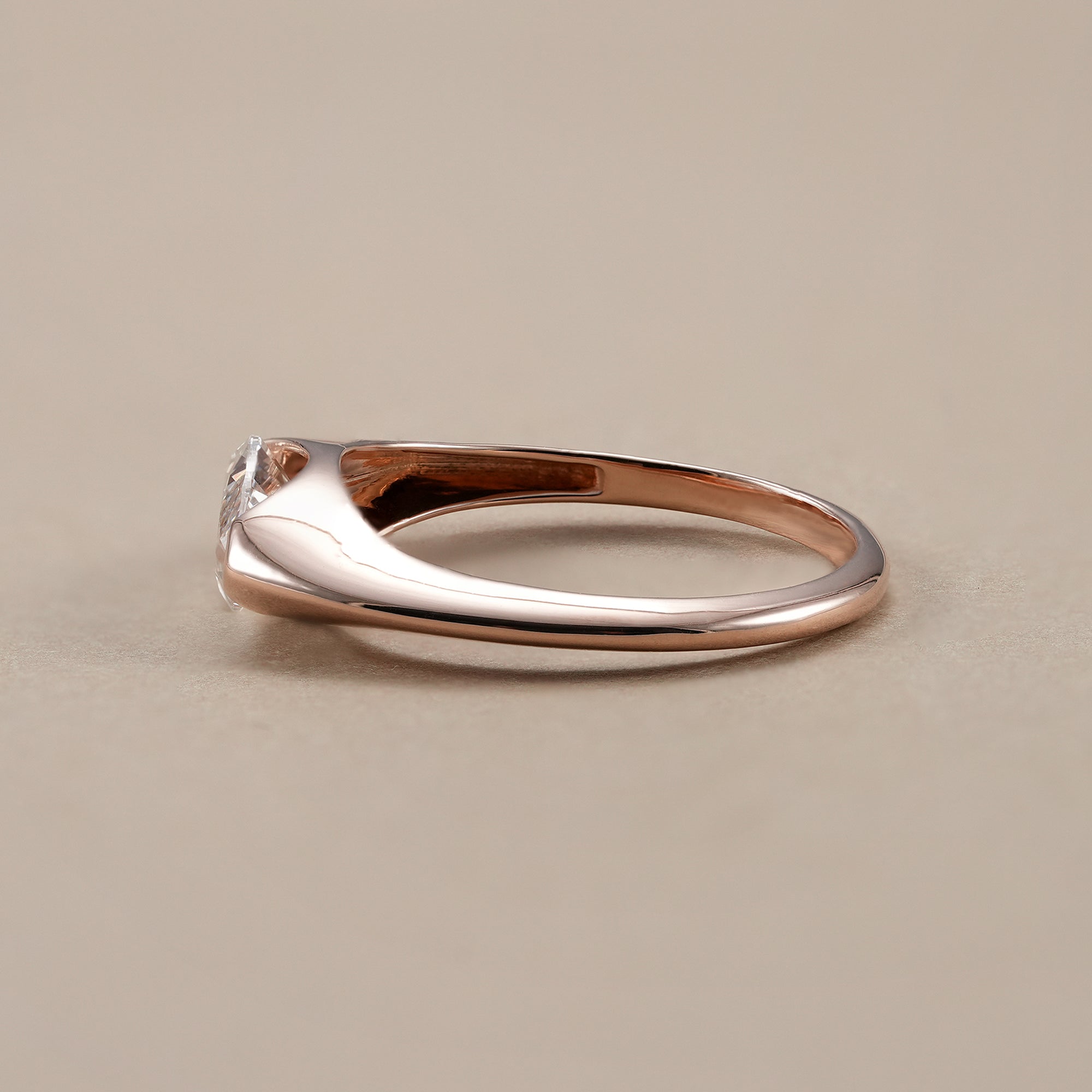 Half bezel lab grown marquise diamond engagement ring.