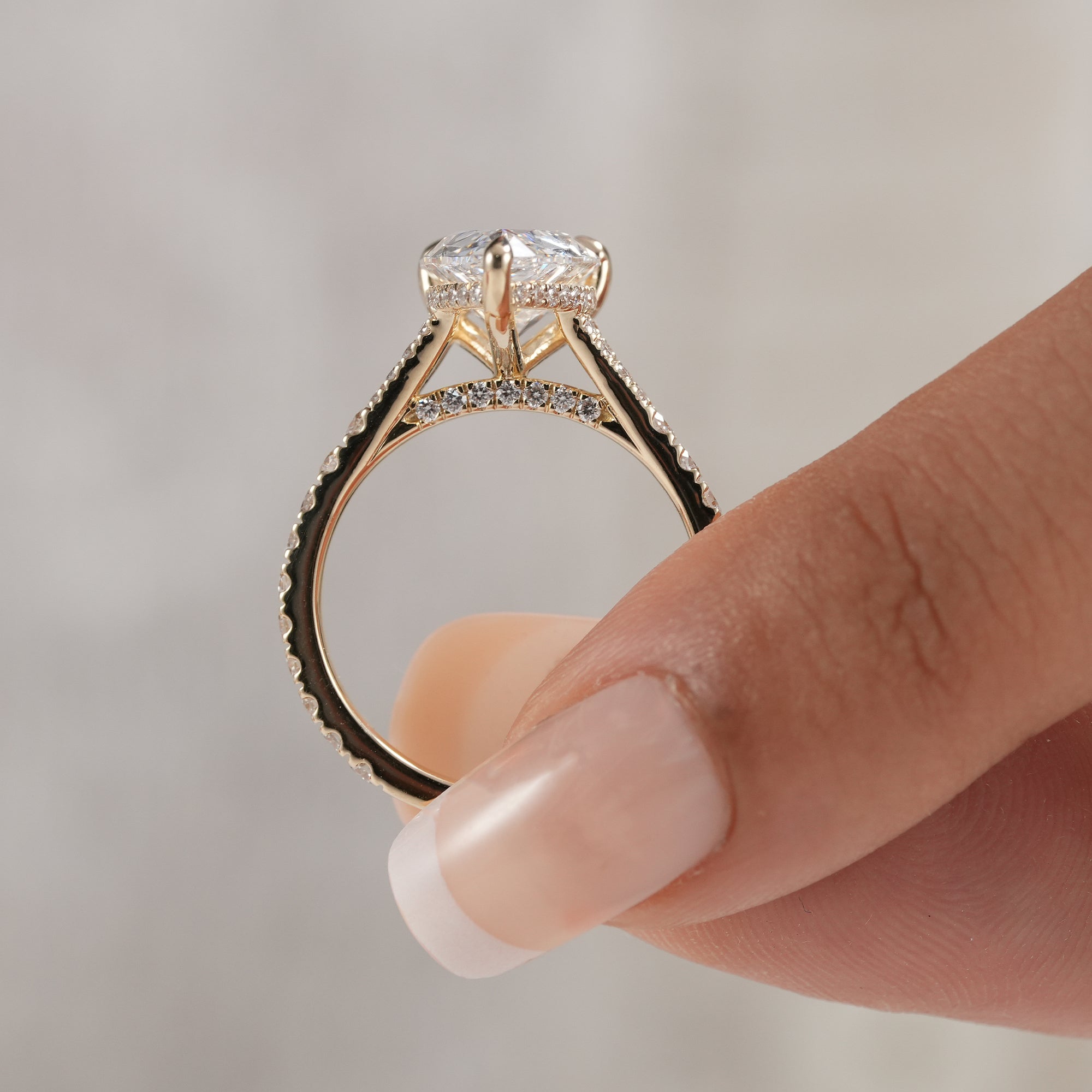 Pear diamond ring with diamond accented split shank band