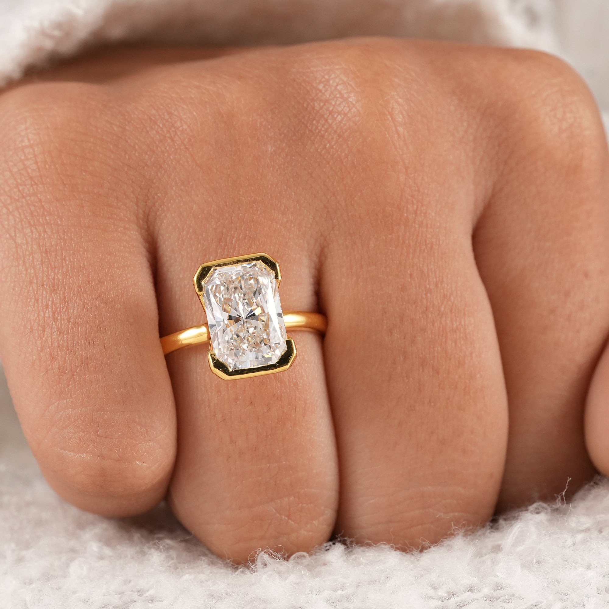 Fine jewelry radiant diamond solitaire ring for weddings and proposals.
