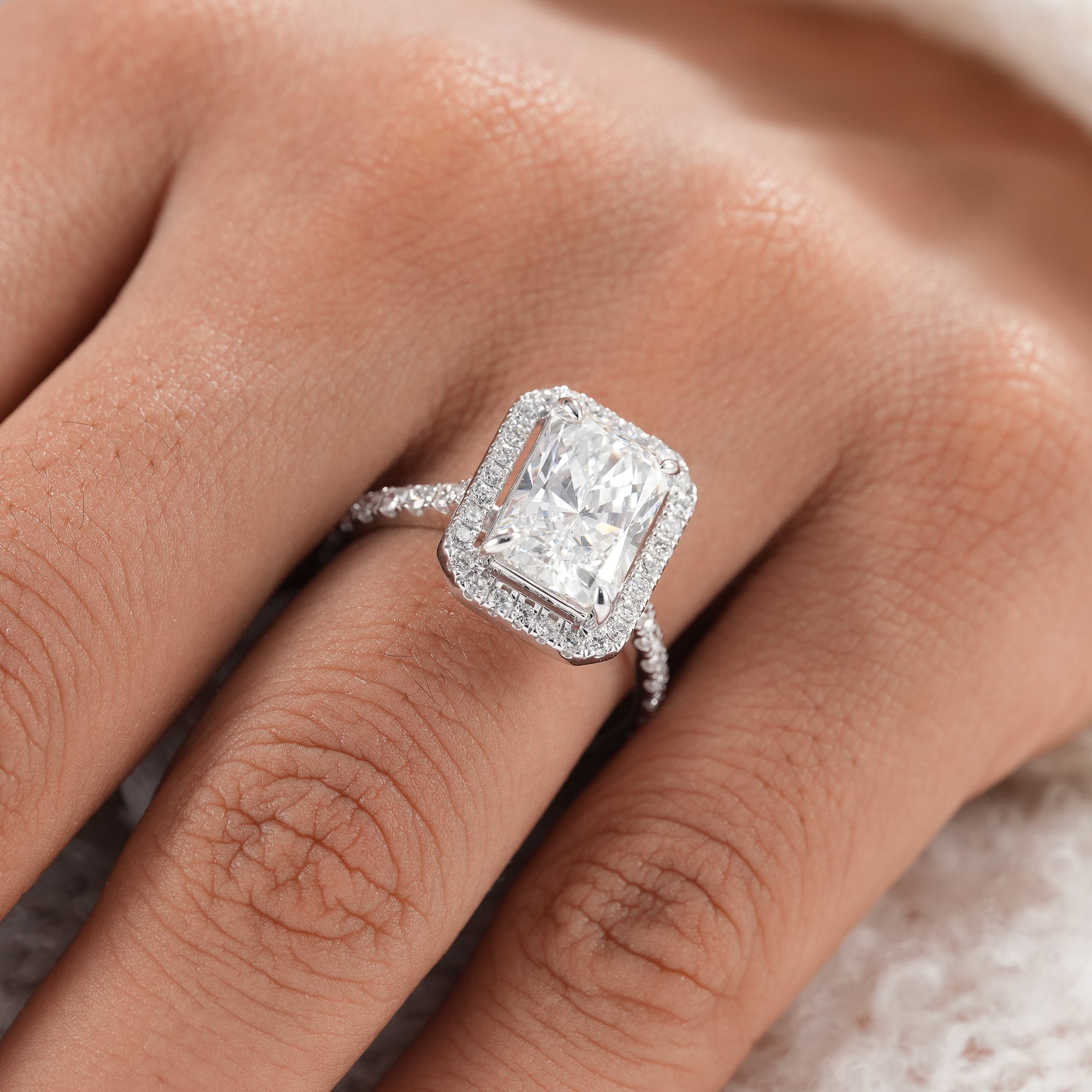 Fine jewelry radiant diamond ring for bridal wear.
