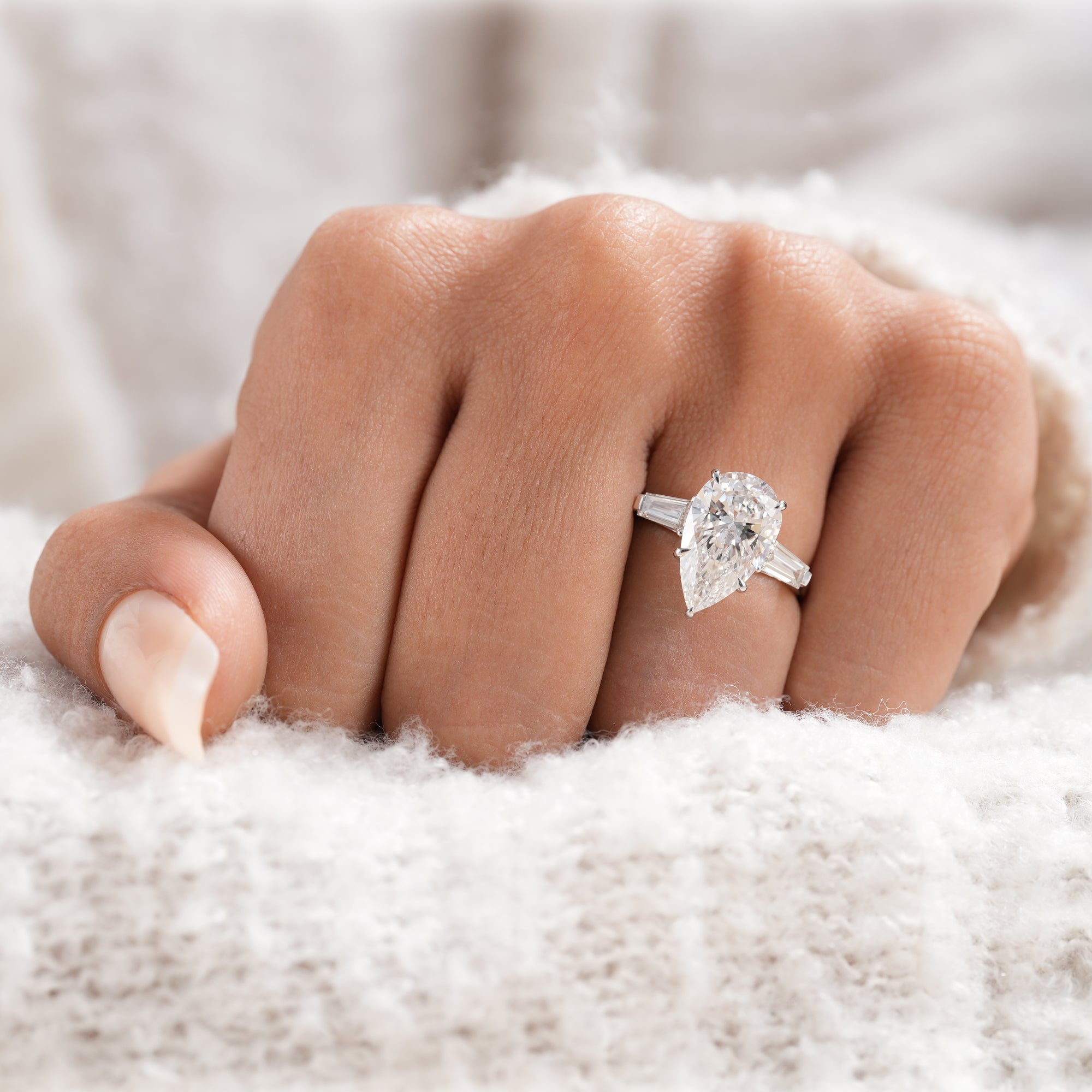 Pear cut lab diamond bridal ring with baguette accents