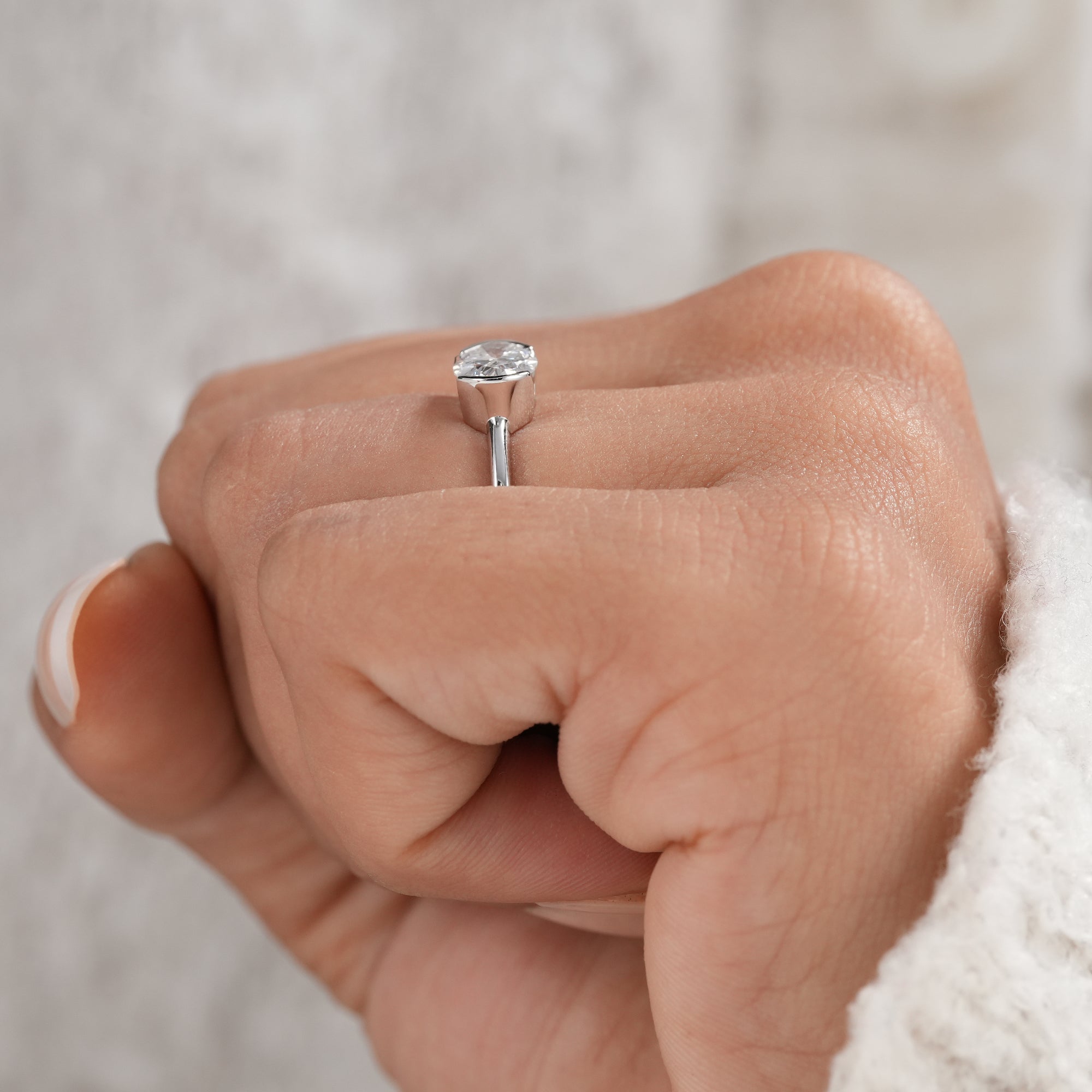 Half bezel oval diamond solitaire bridal jewelry