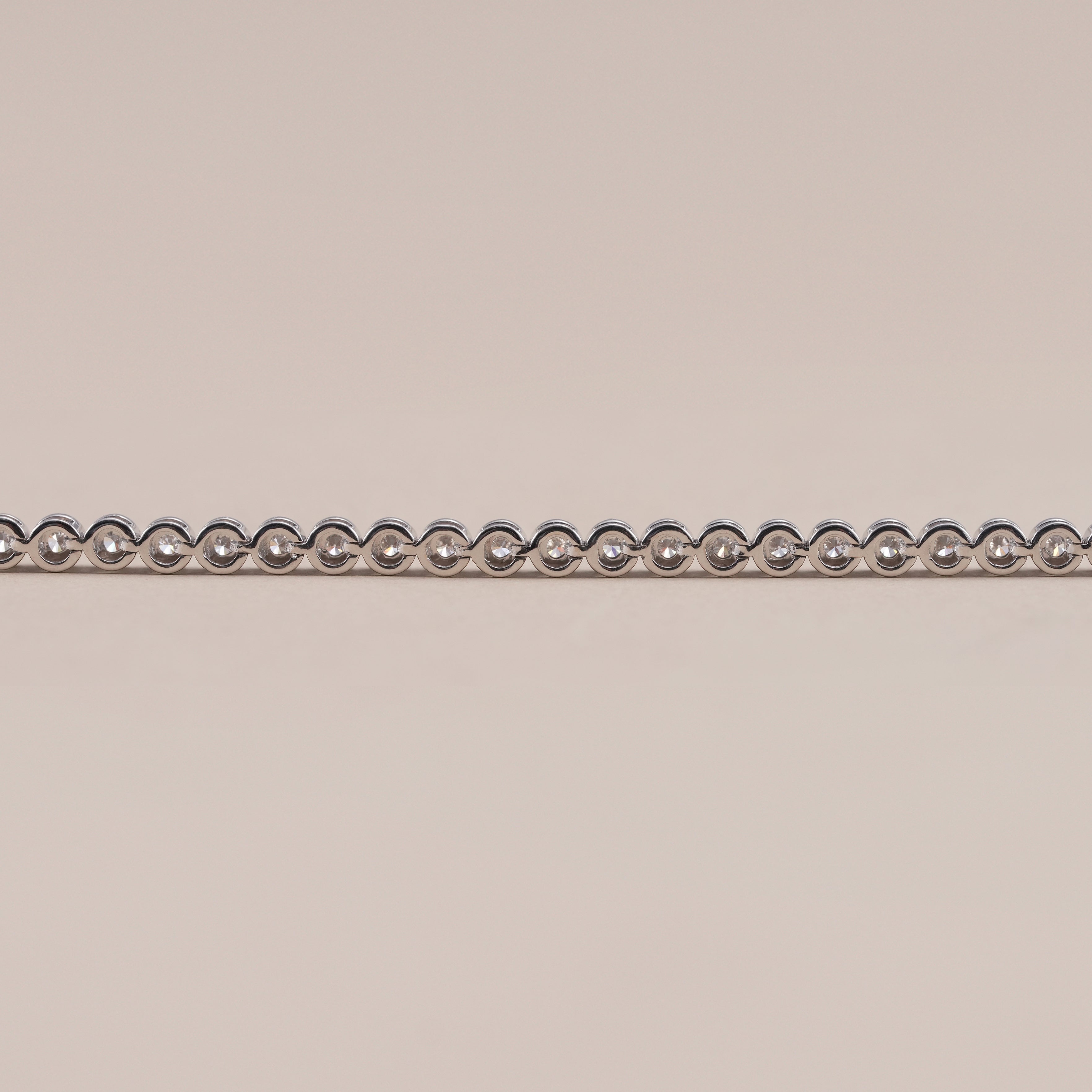 Luxury round diamond tennis bracelet handcrafted in precious metal.