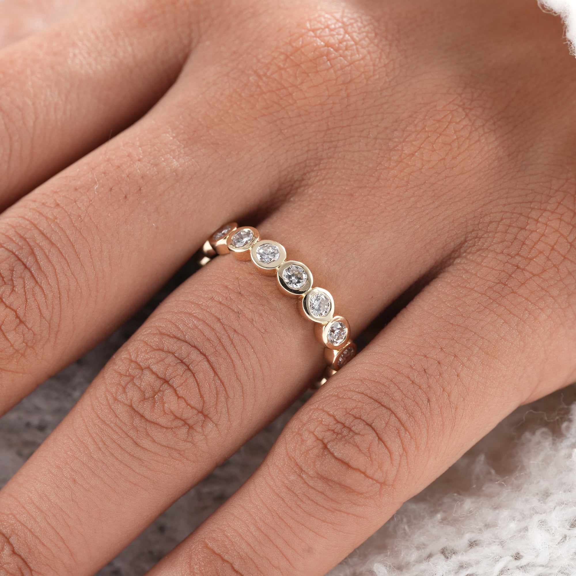 Handmade bezel set diamond anniversary ring.