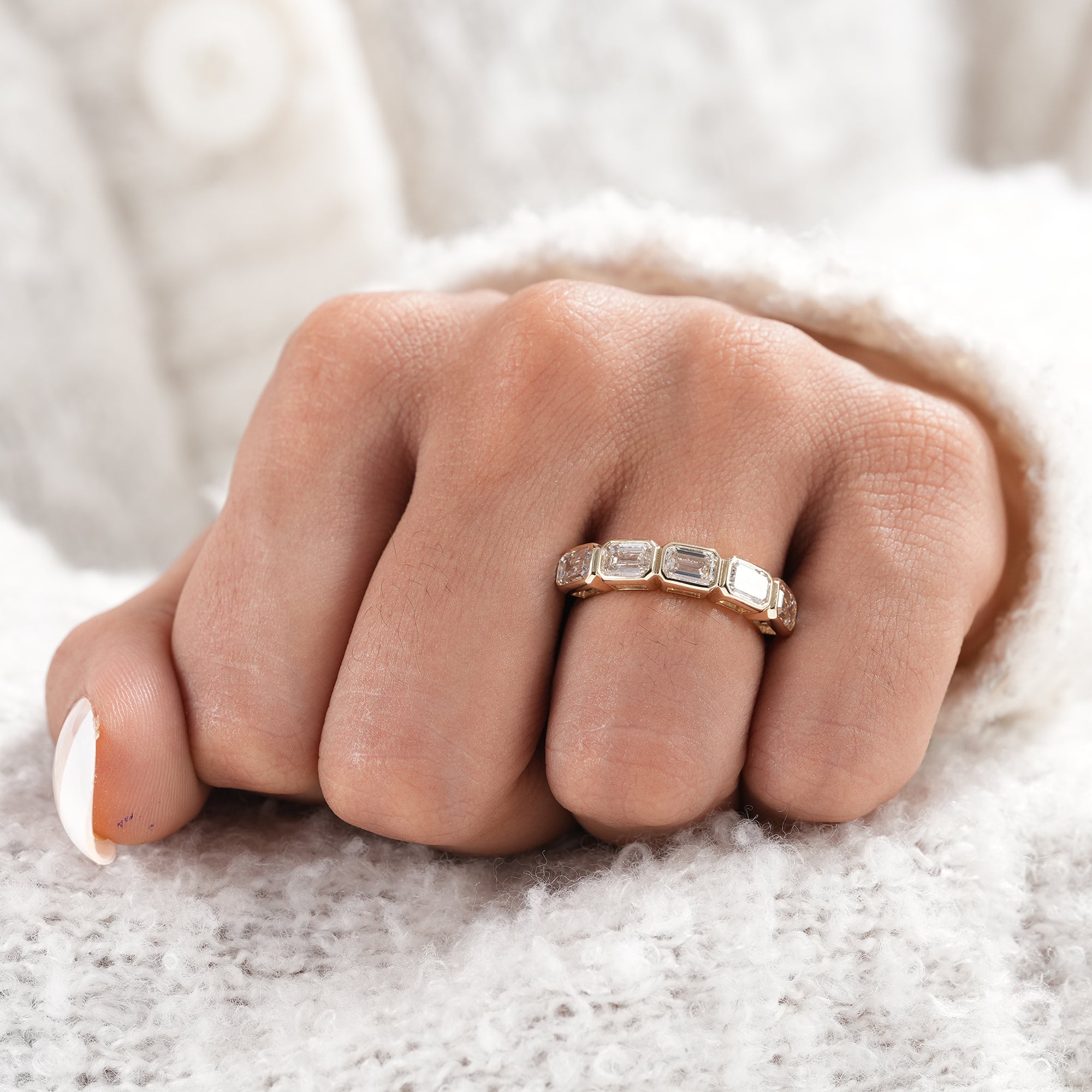 Contemporary five stone lab grown diamond band.