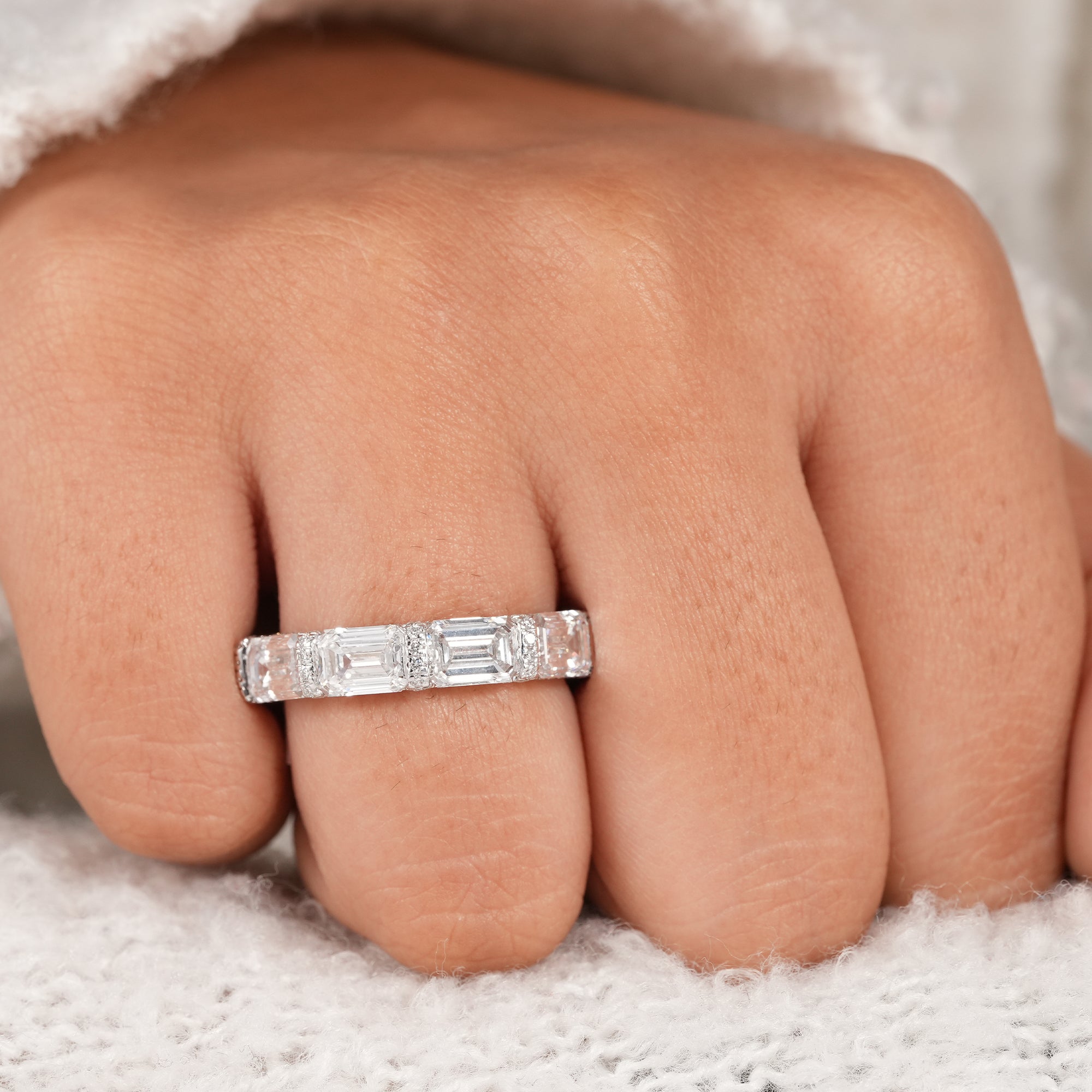 Elegant emerald cut anniversary ring with lab diamonds.