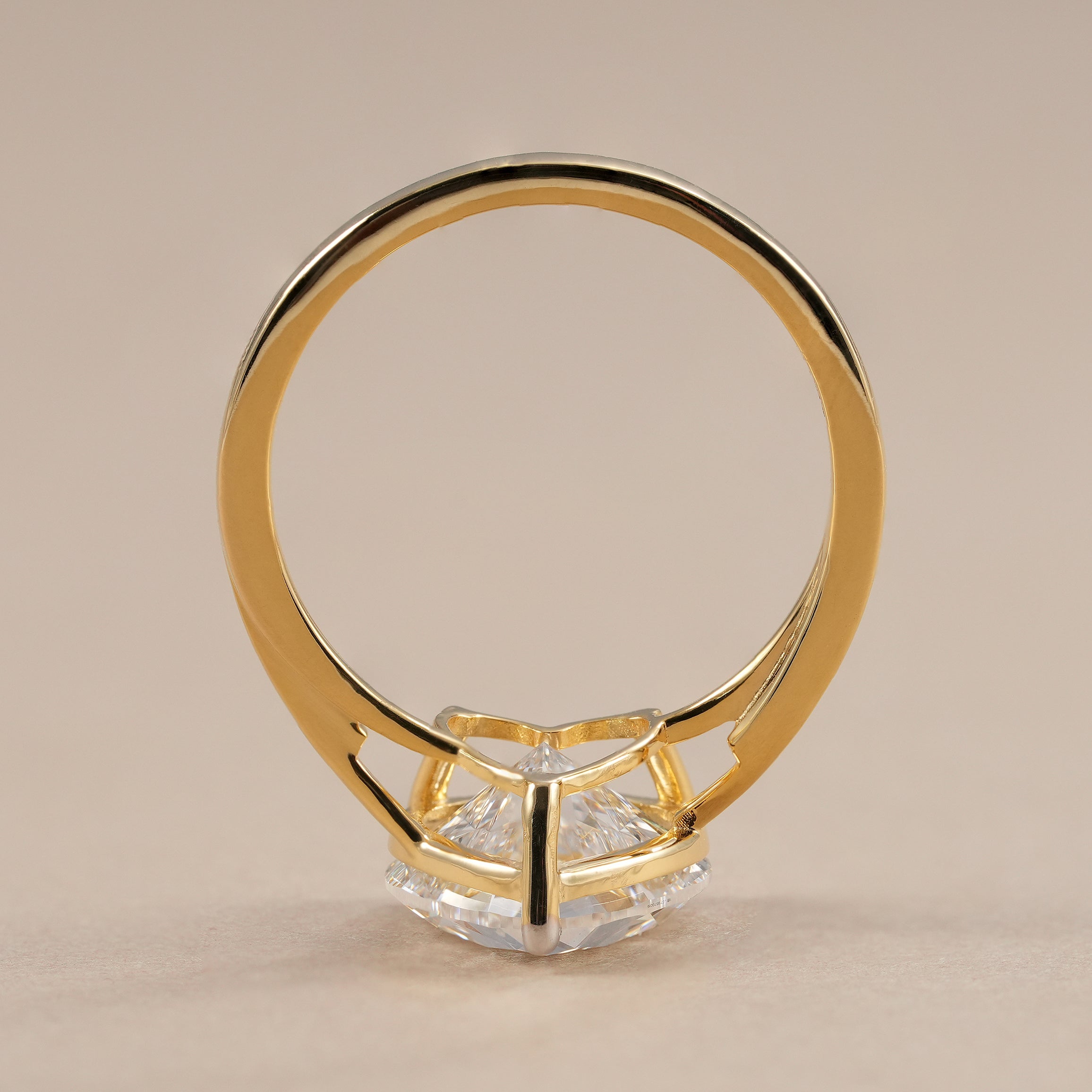 Modern bypass engagement ring with heart shaped diamond.