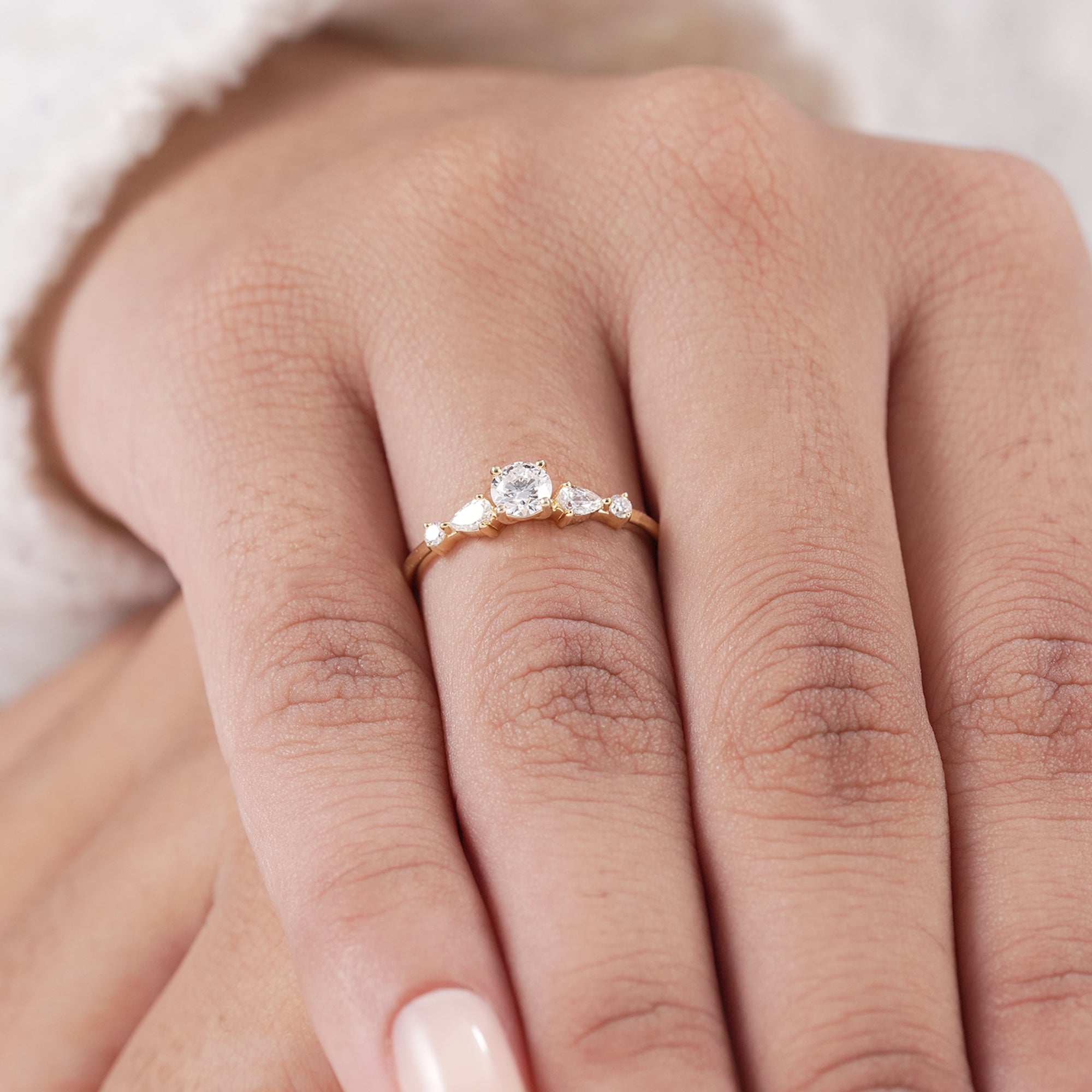 Luxury round diamond engagement ring with pear accents