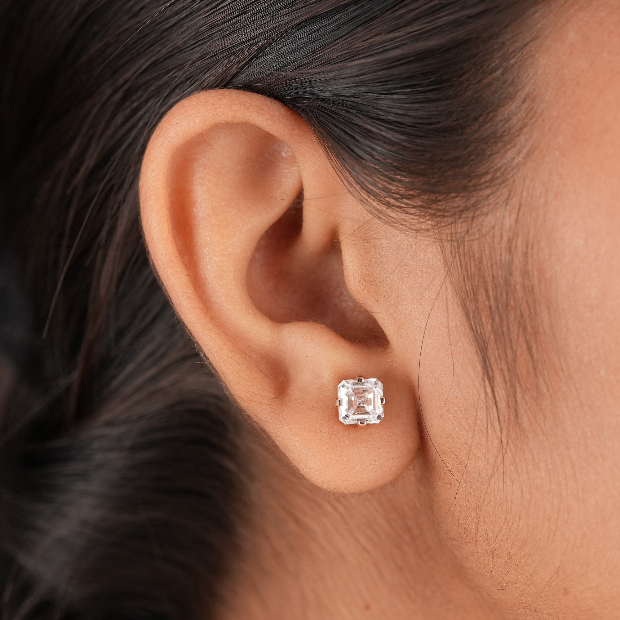 Minimalist solitaire lab diamond earrings featuring Asscher cut diamonds in a timeless design.