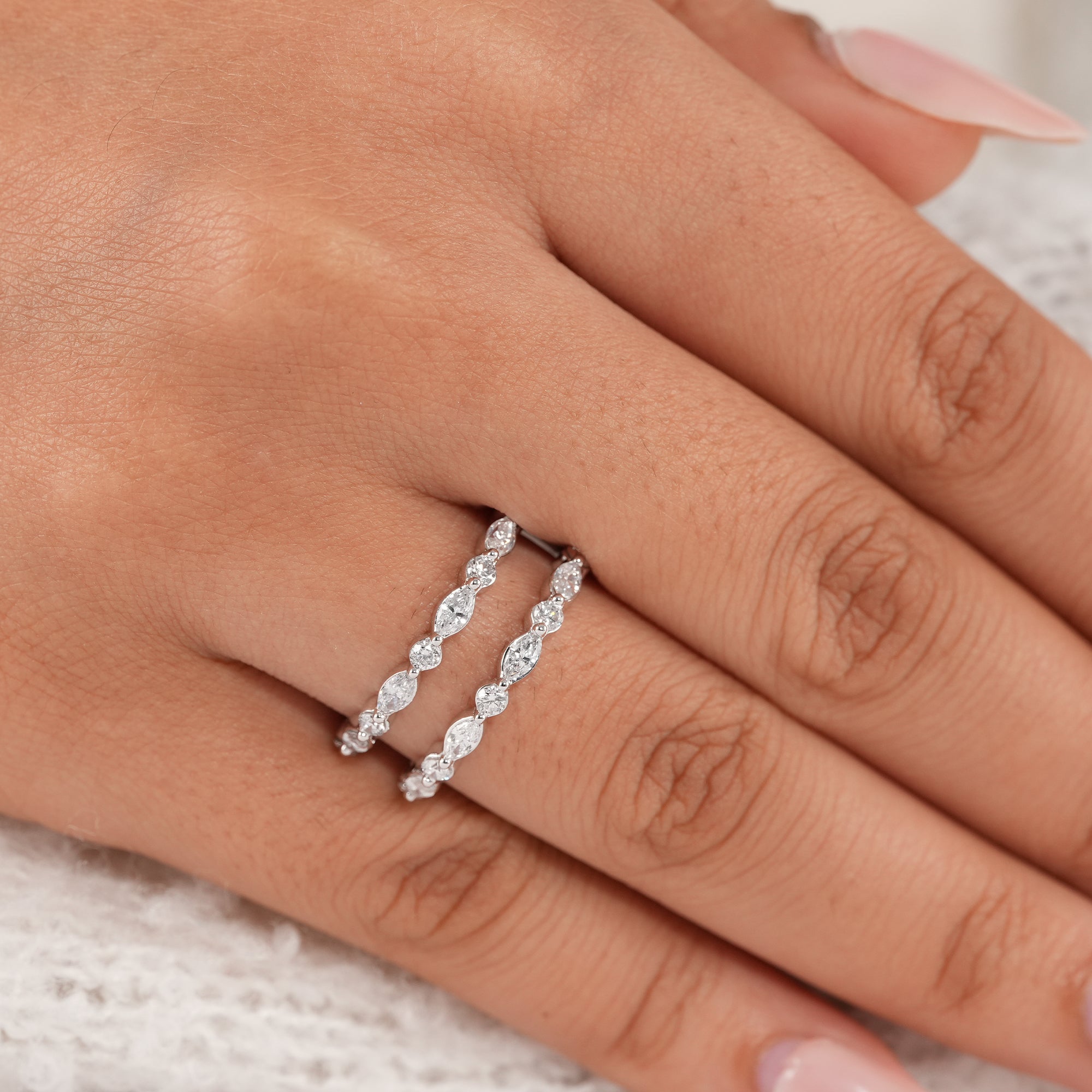Contemporary marquise and round diamond stack ring.