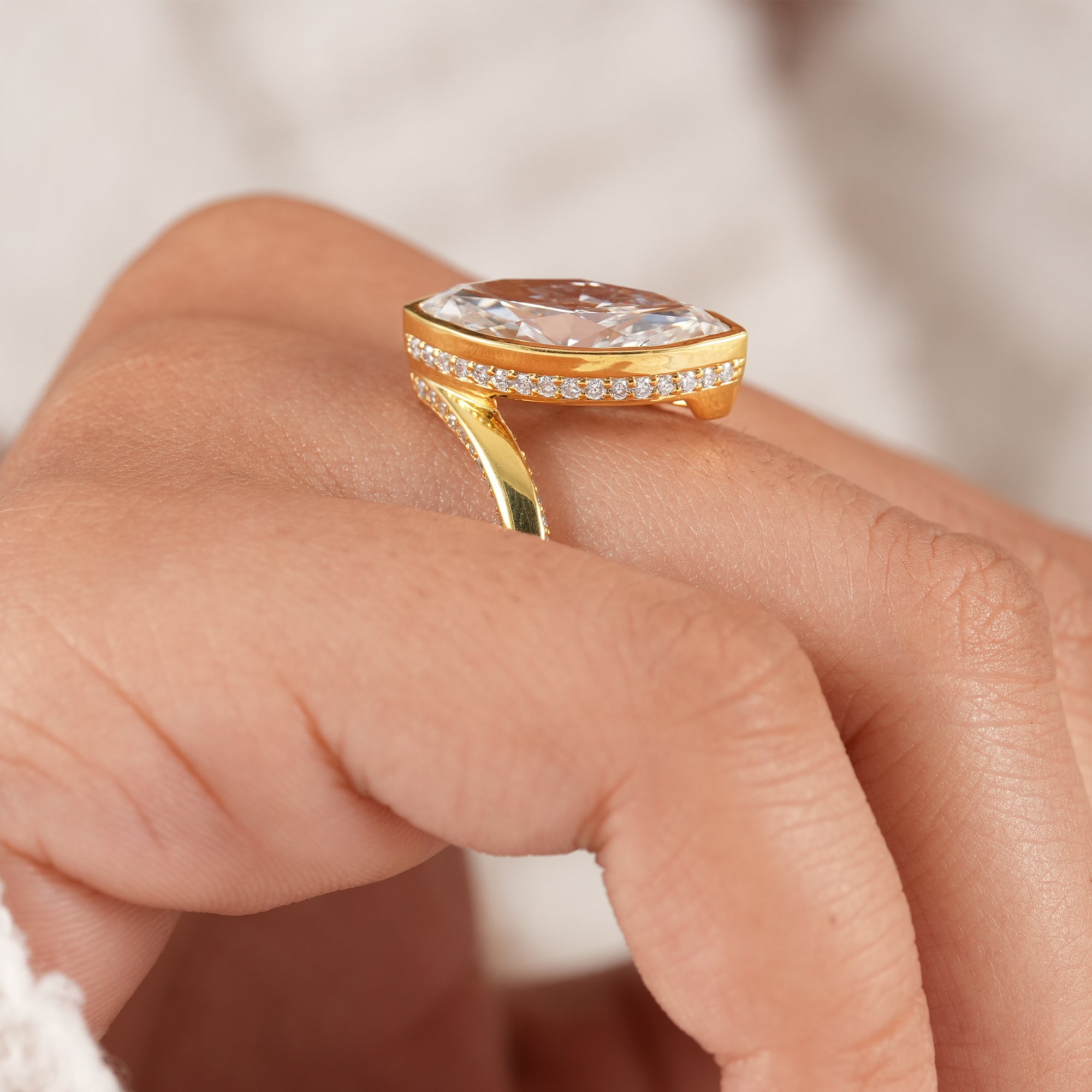 Contemporary marquise engagement ring with full diamond detailing.