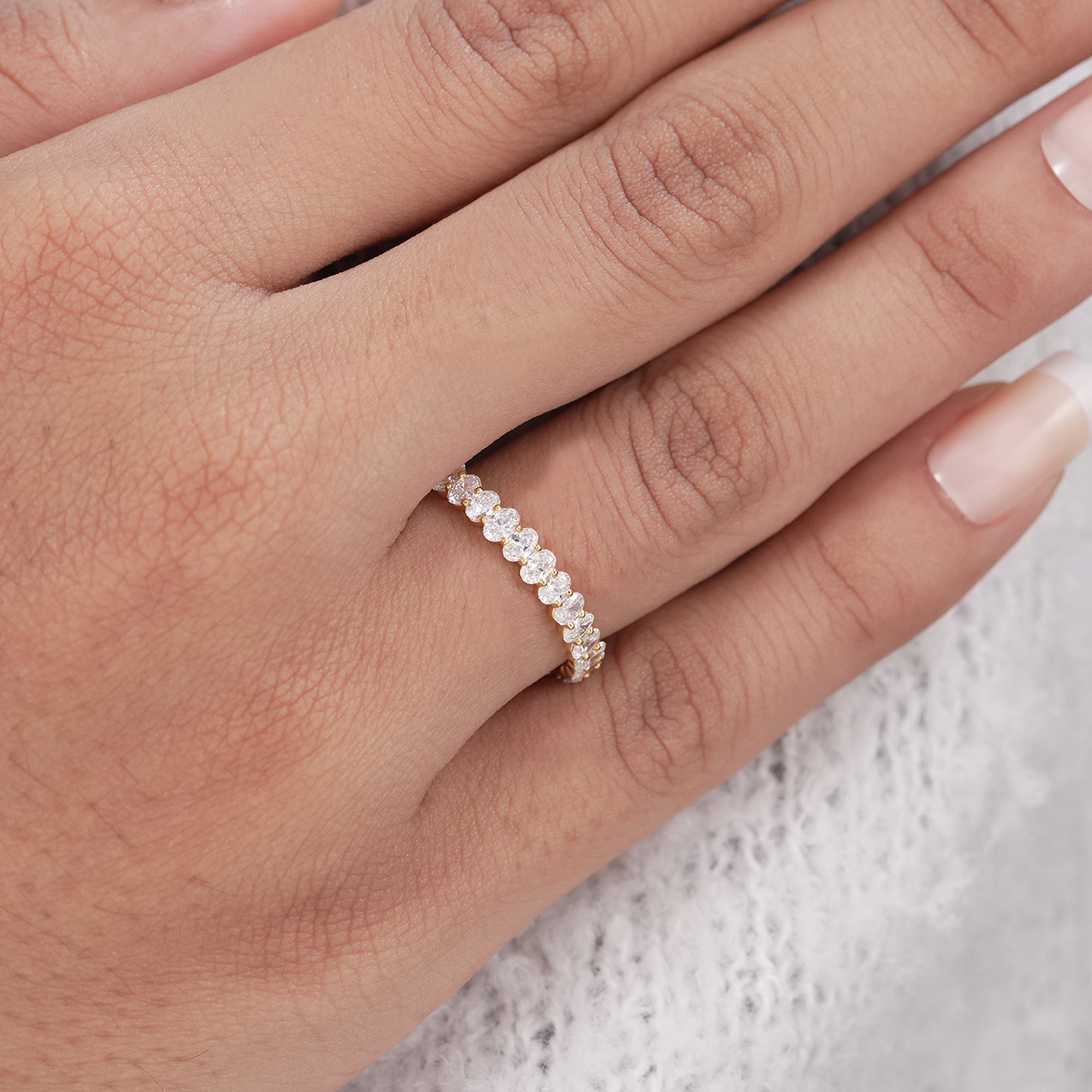 Luxury oval diamond wedding band in solid gold.