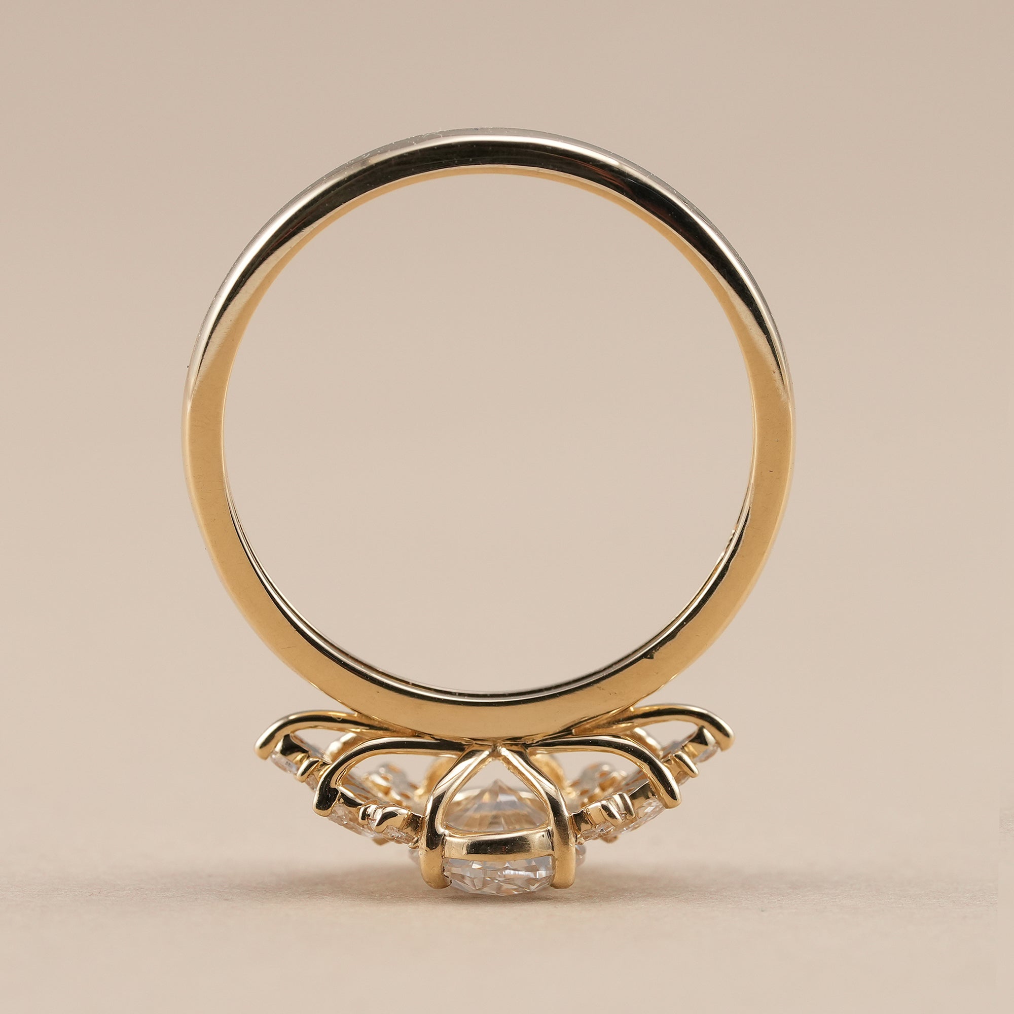 Oval cut lab grown diamond ring with marquise and round diamonds