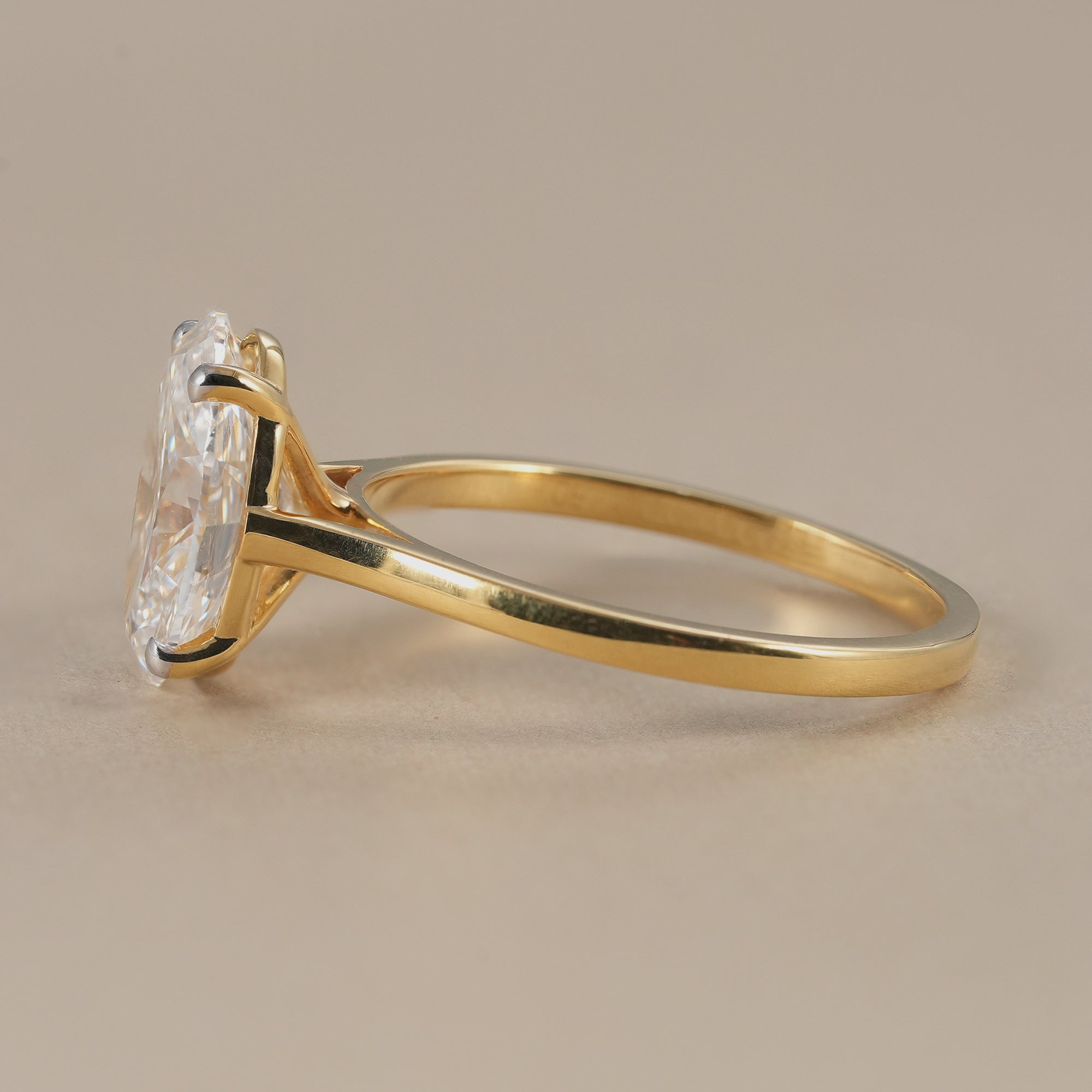 Oval solitaire diamond ring in 14K yellow gold