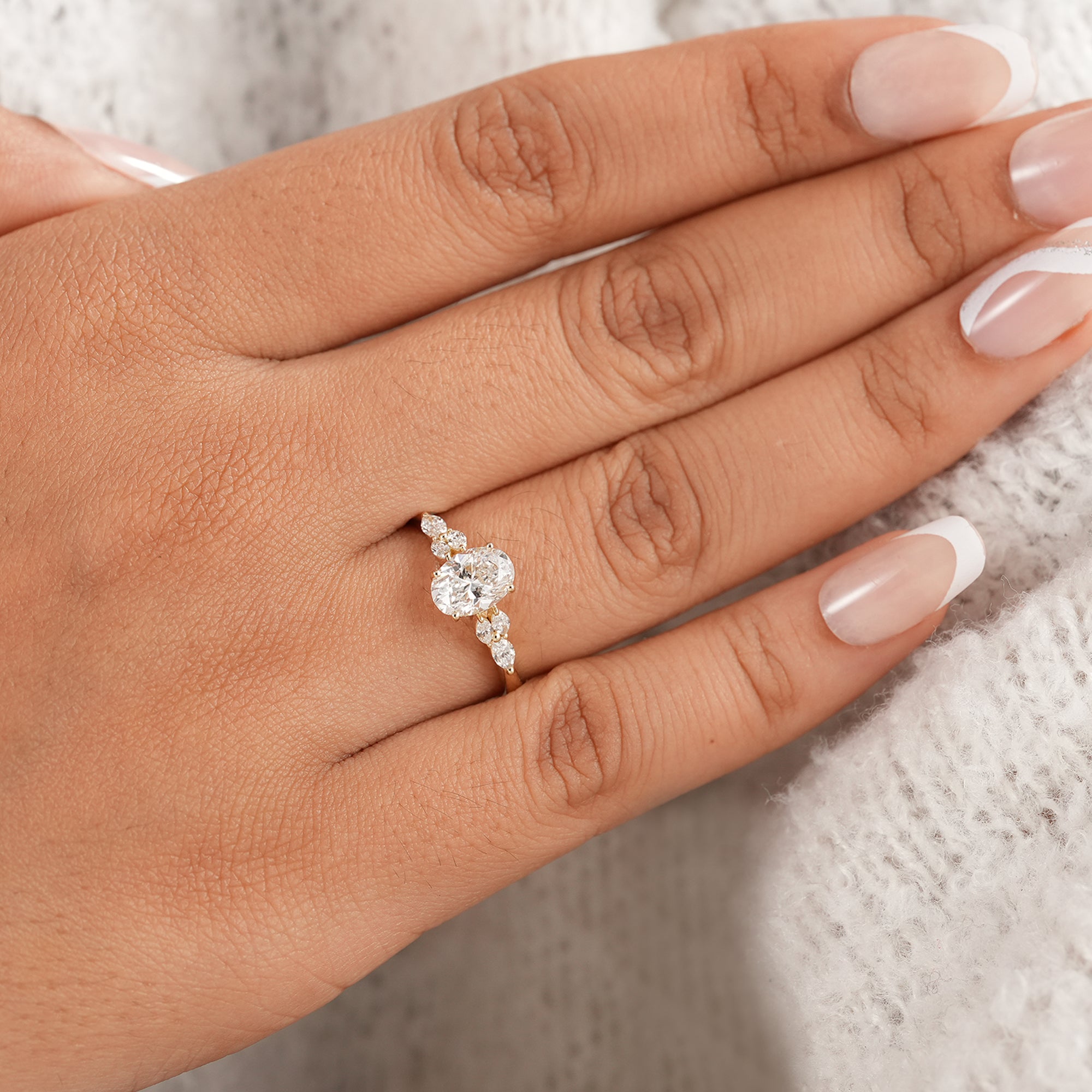 Luxury oval proposal ring with marquise accent diamonds