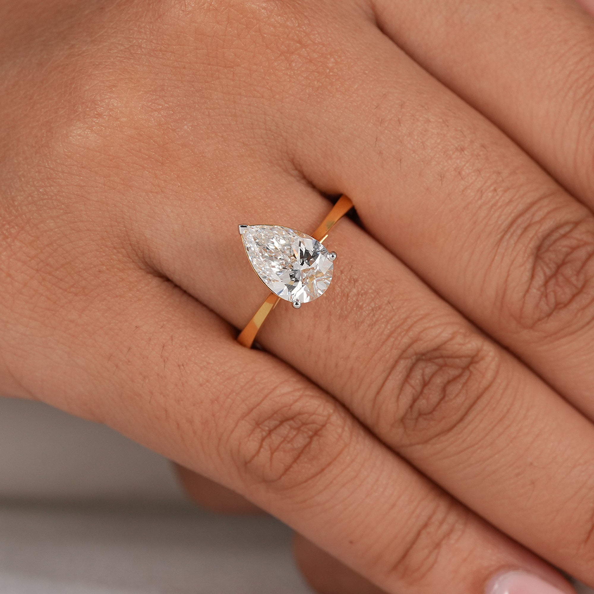 Sustainable pear lab diamond solitaire ring
