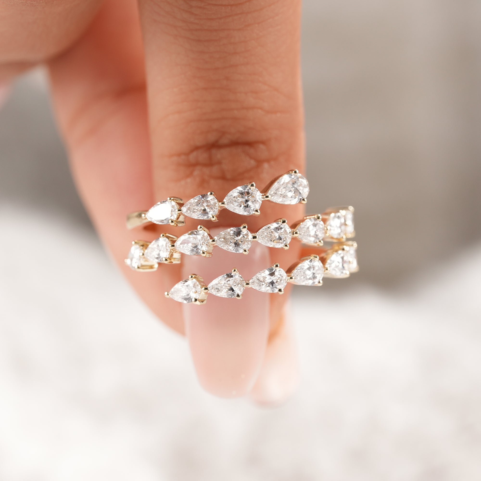 Fine jewelry pear diamond ring with modern design.