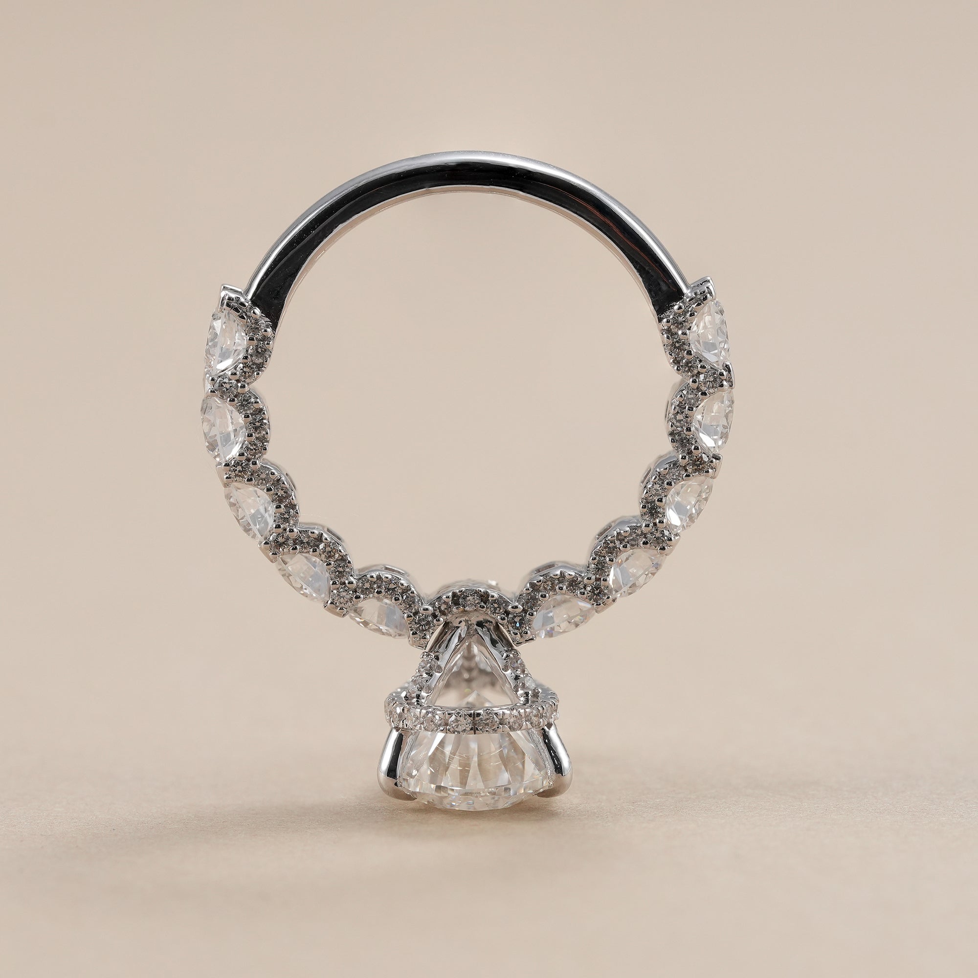 Pear lab diamond engagement ring with sparkling diamond band.