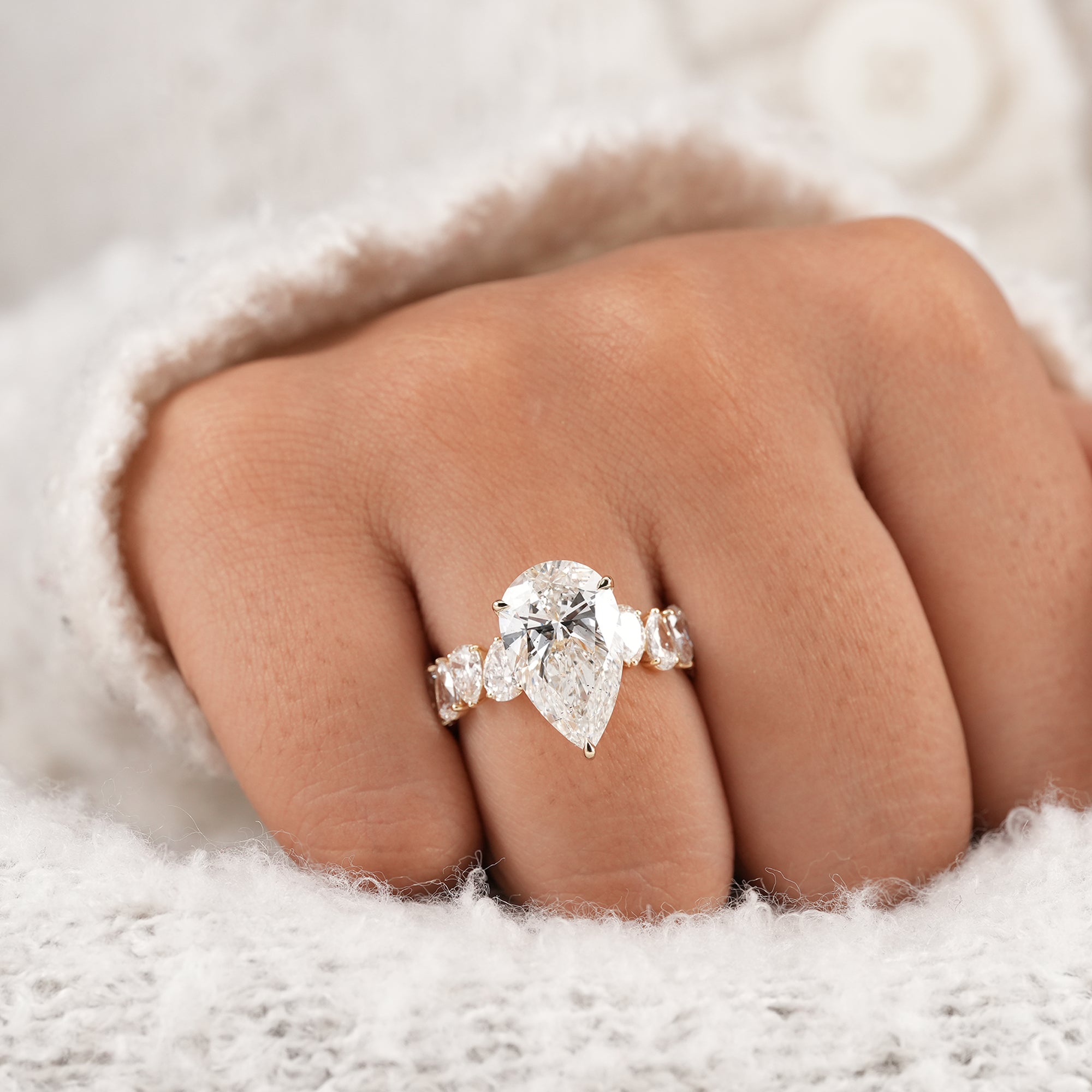 Women's pear diamond proposal ring with accent stones