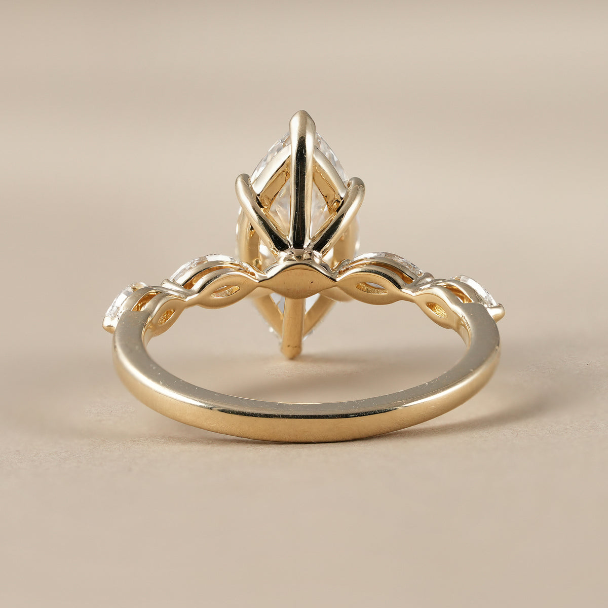 Sustainable lab grown diamond ring featuring a 2 CT marquise center stone.