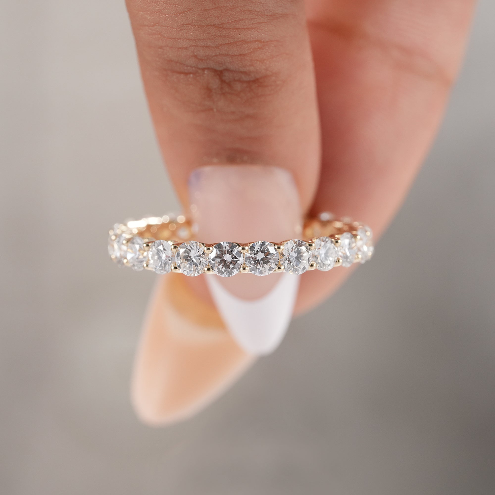 Classic round diamond anniversary band in solid gold.