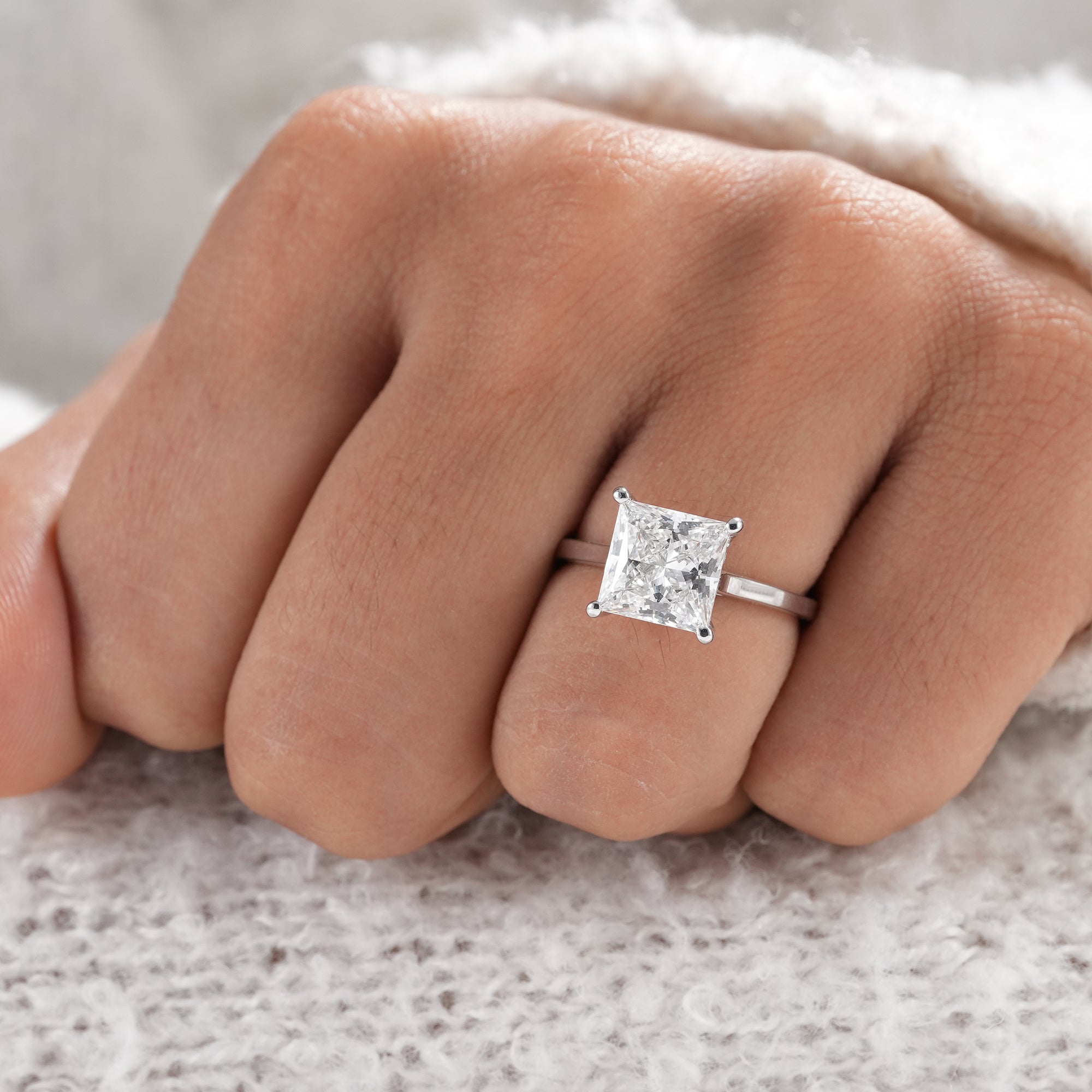 Hidden halo princess diamond ring handcrafted in white gold.