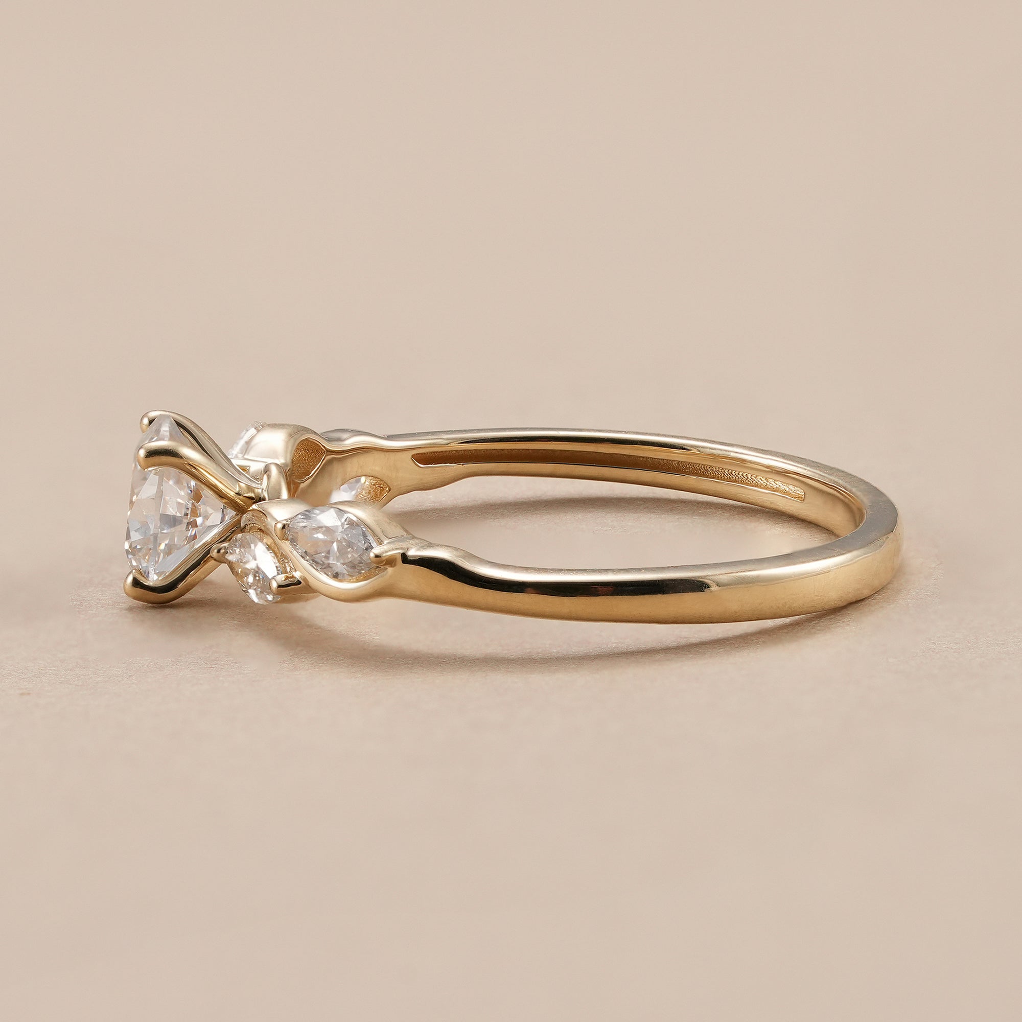 Wave shank engagement ring featuring round brilliant lab diamond.
