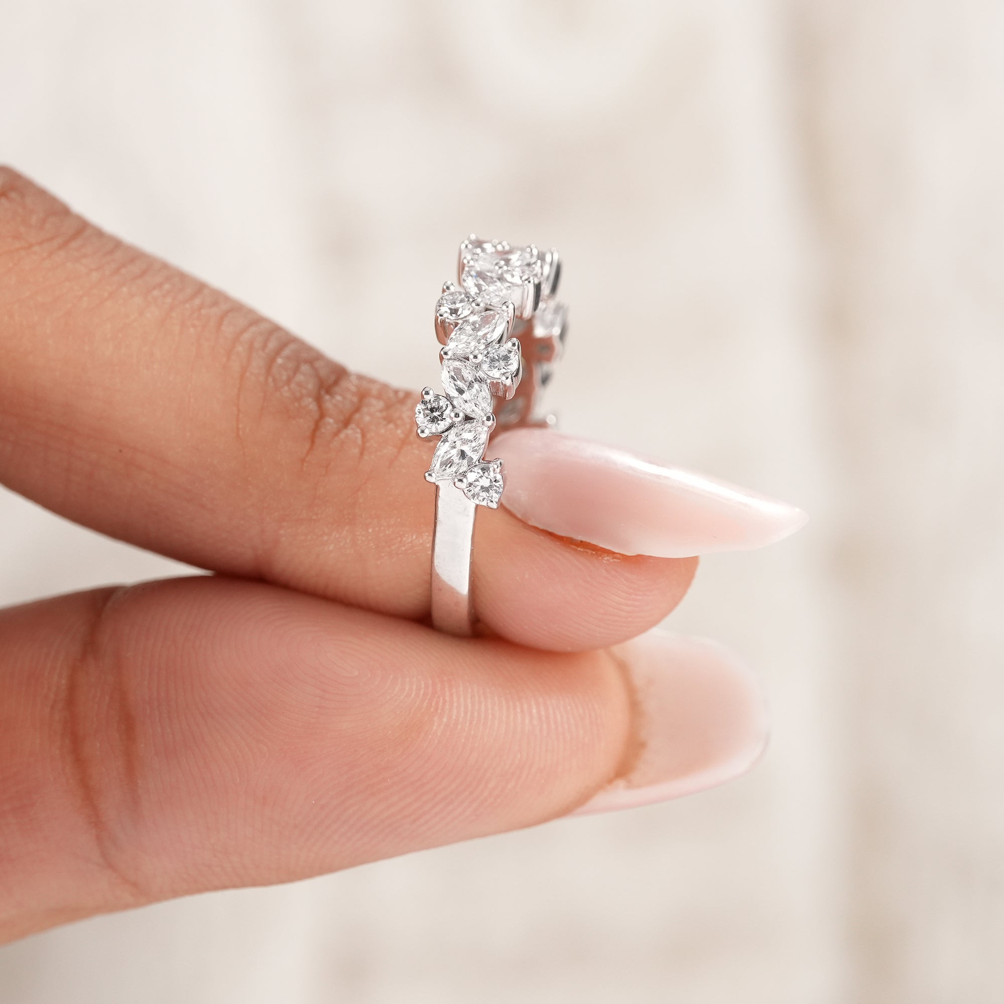 White gold marquise cluster diamond ring for stacking.