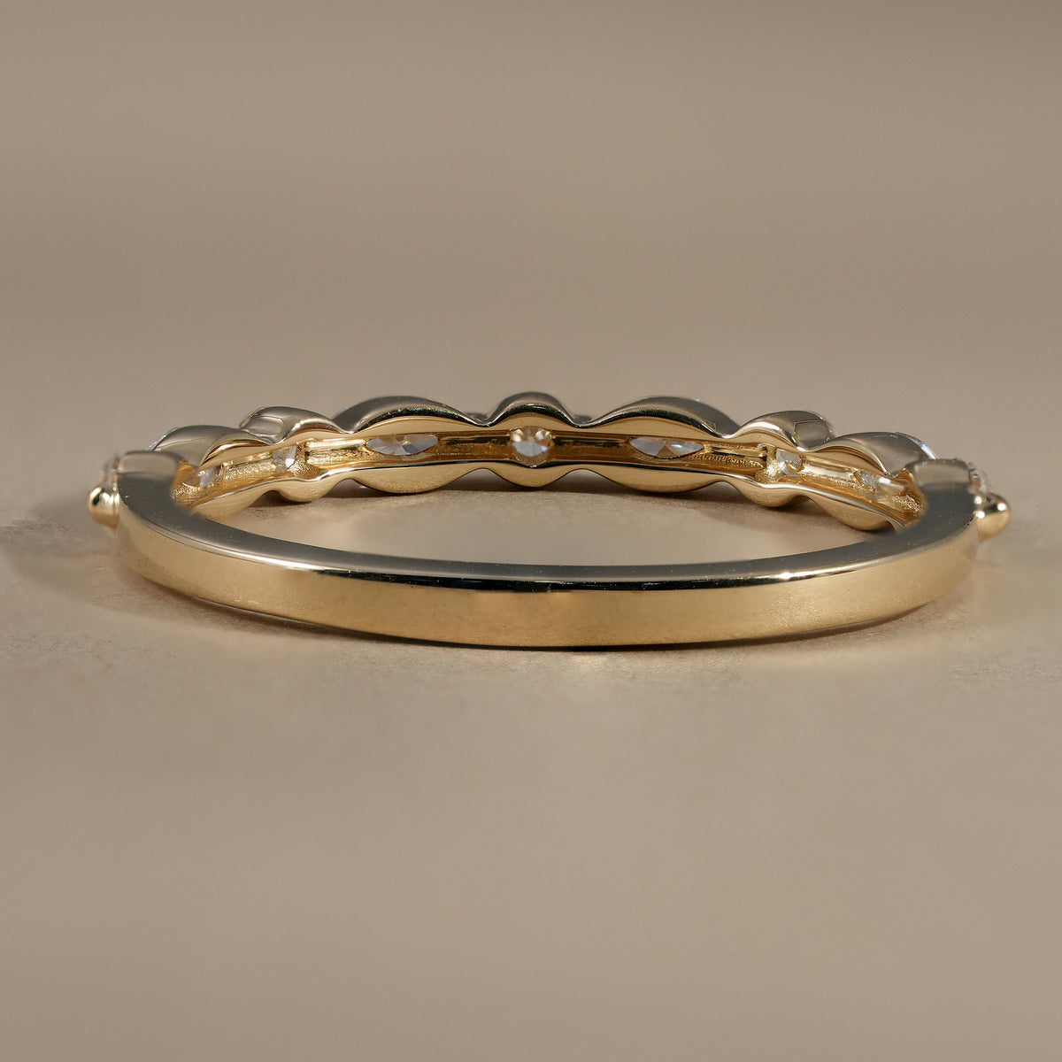 Luxury marquise and round diamond wedding band crafted in polished yellow gold.