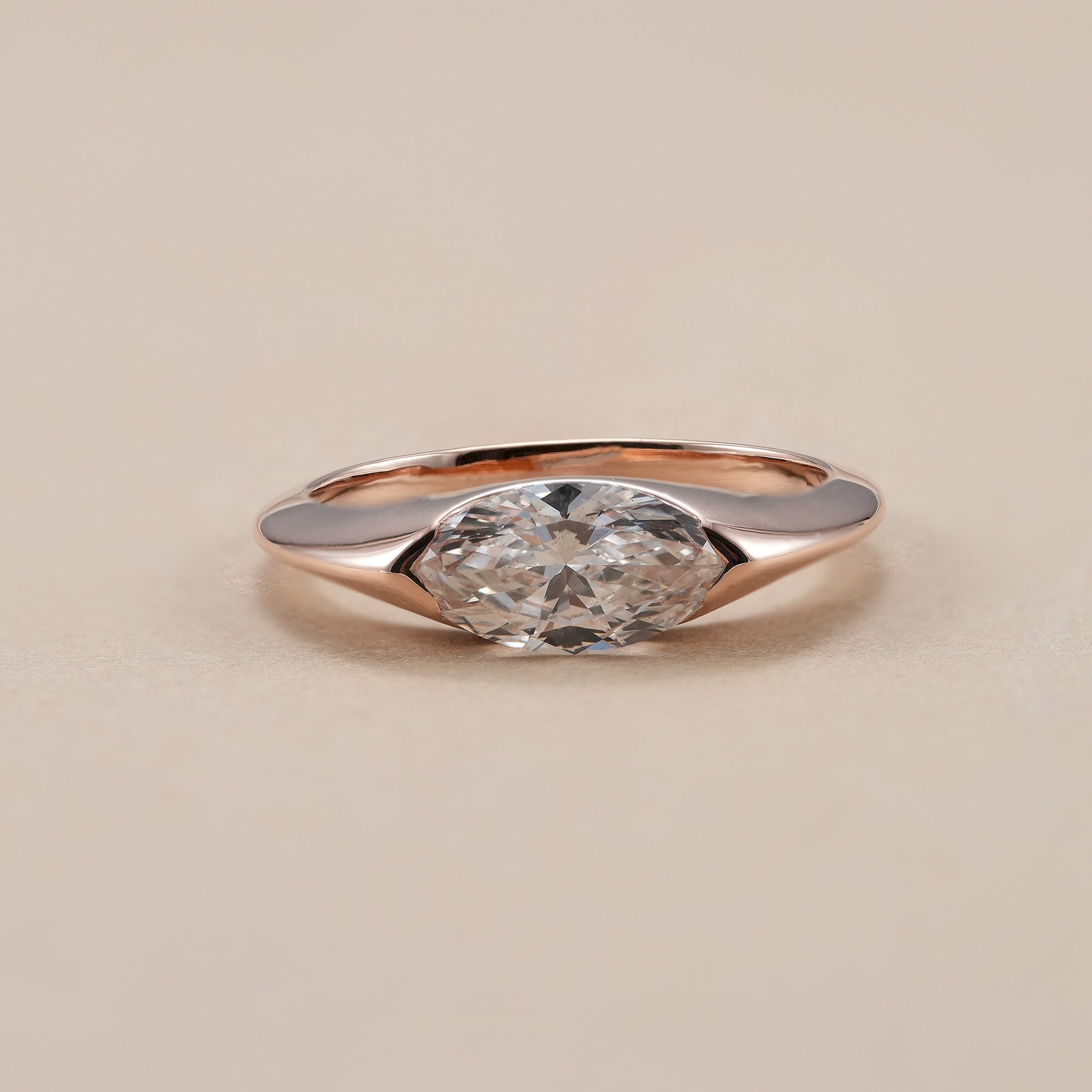 Marquise diamond ring with IGI certified lab grown diamond in half bezel setting.