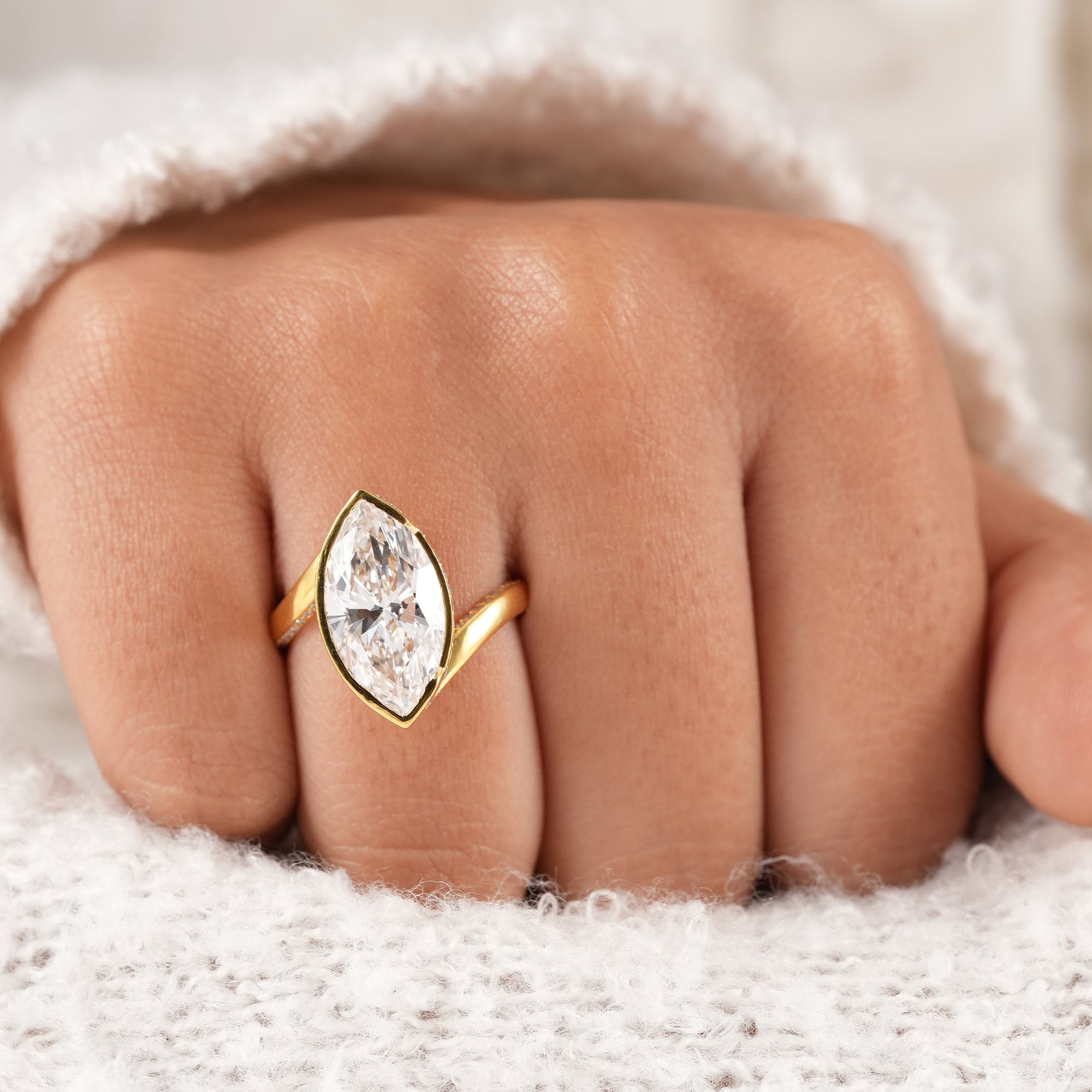 Fine jewelry marquise diamond ring handcrafted in yellow gold.