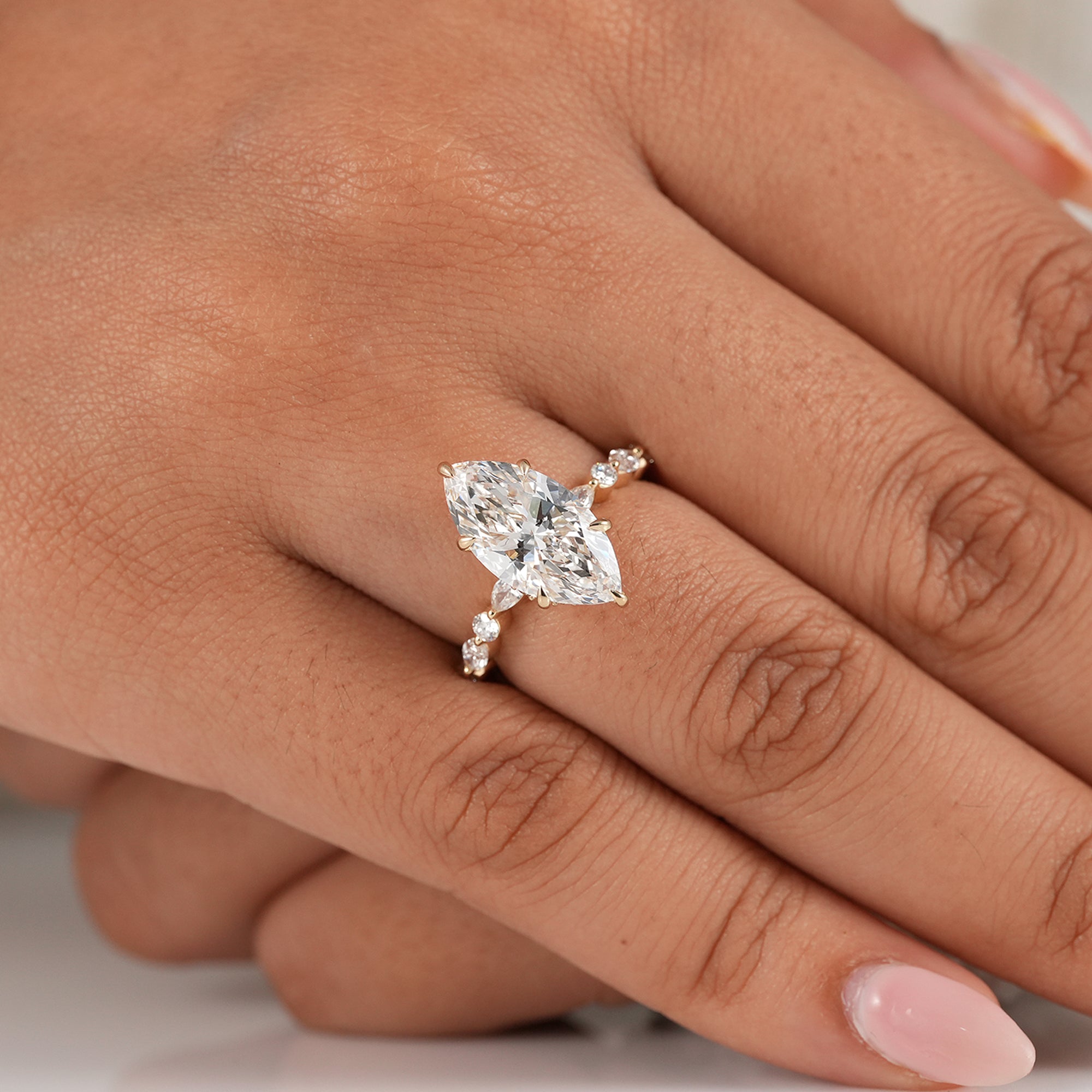 Luxury marquise solitaire ring with round and marquise accents
