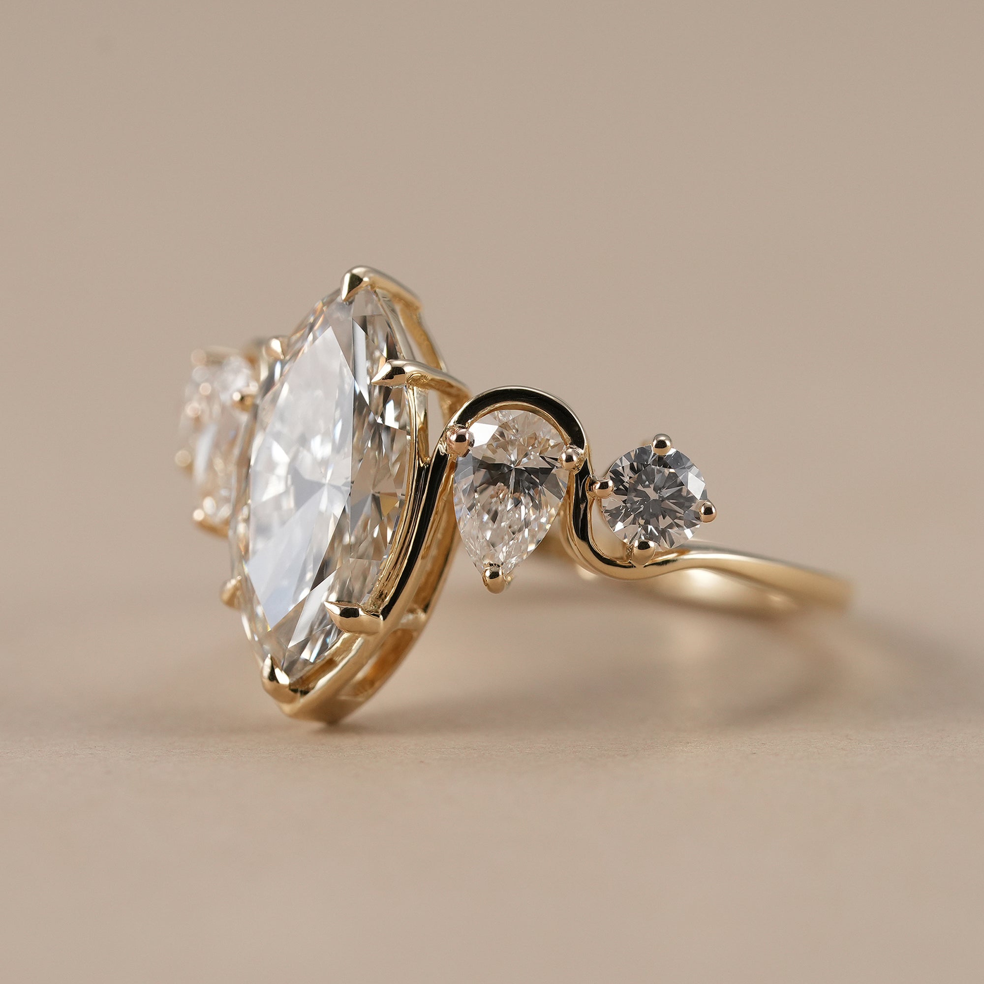 Five stone marquise diamond engagement ring in yellow gold